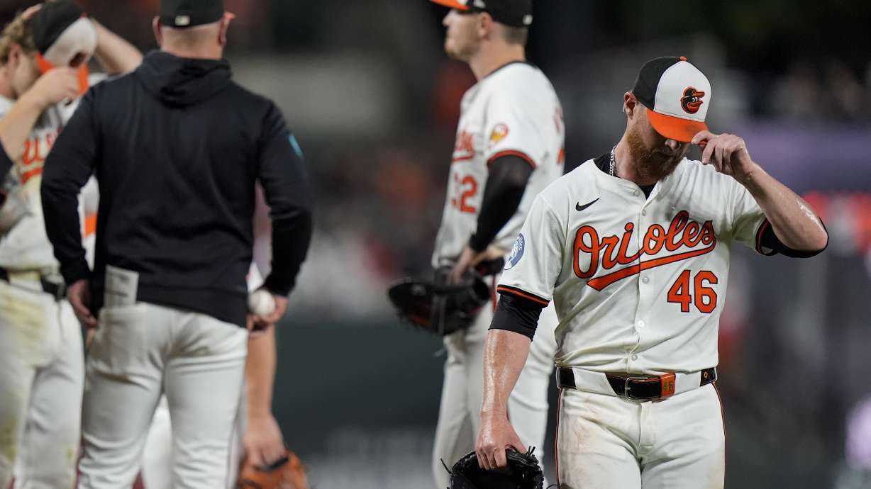 Baltimore Orioles relief pitcher Craig Kimbrel (46) returns to the dugout during a pitching change after he gave up six runs during the ninth inning of a baseball game against the San Francisco Giants, Tuesday, Sept. 17, 2024, in Baltimore.