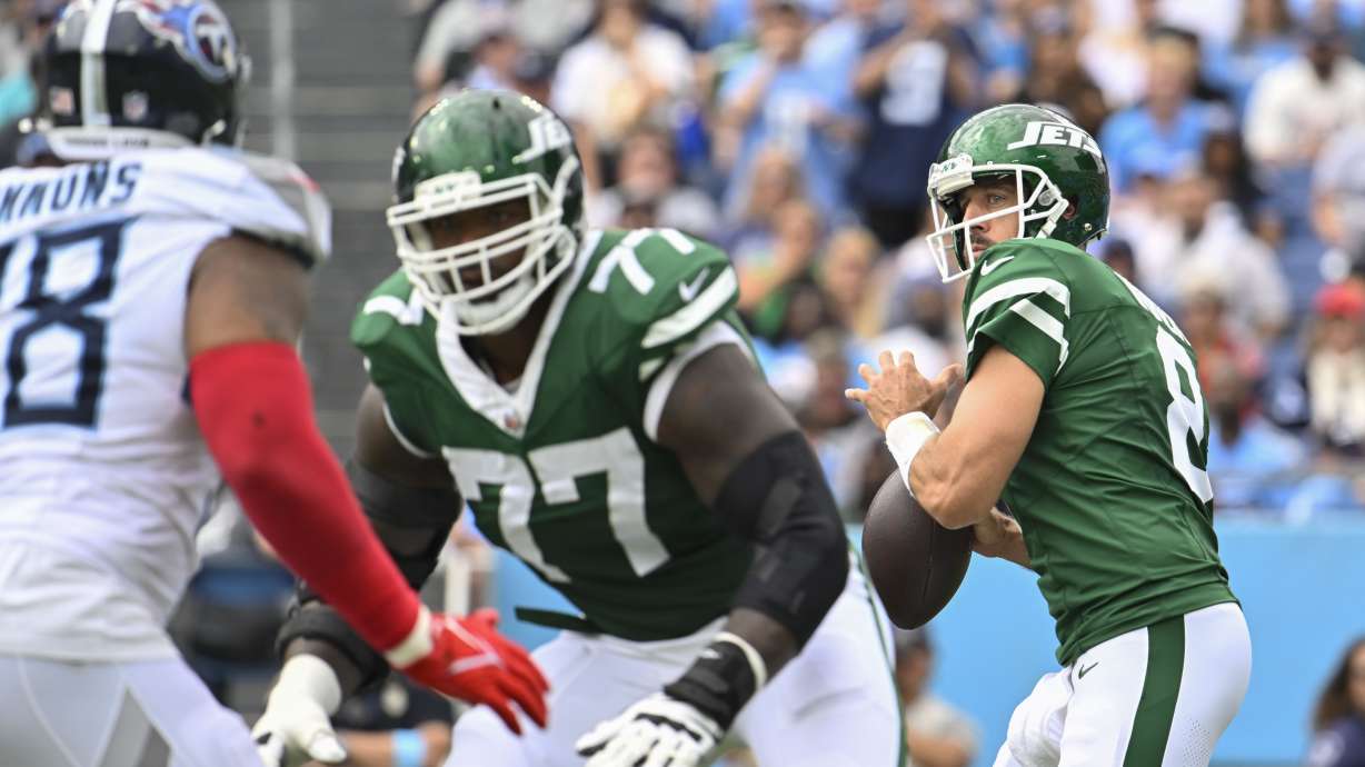 New York Jets quarterback Aaron Rodgers (8) looks to pass in the first half of an NFL football game against the Tennessee Titans in Nashville, Tenn., on Sunday, Sept. 15, 2024.