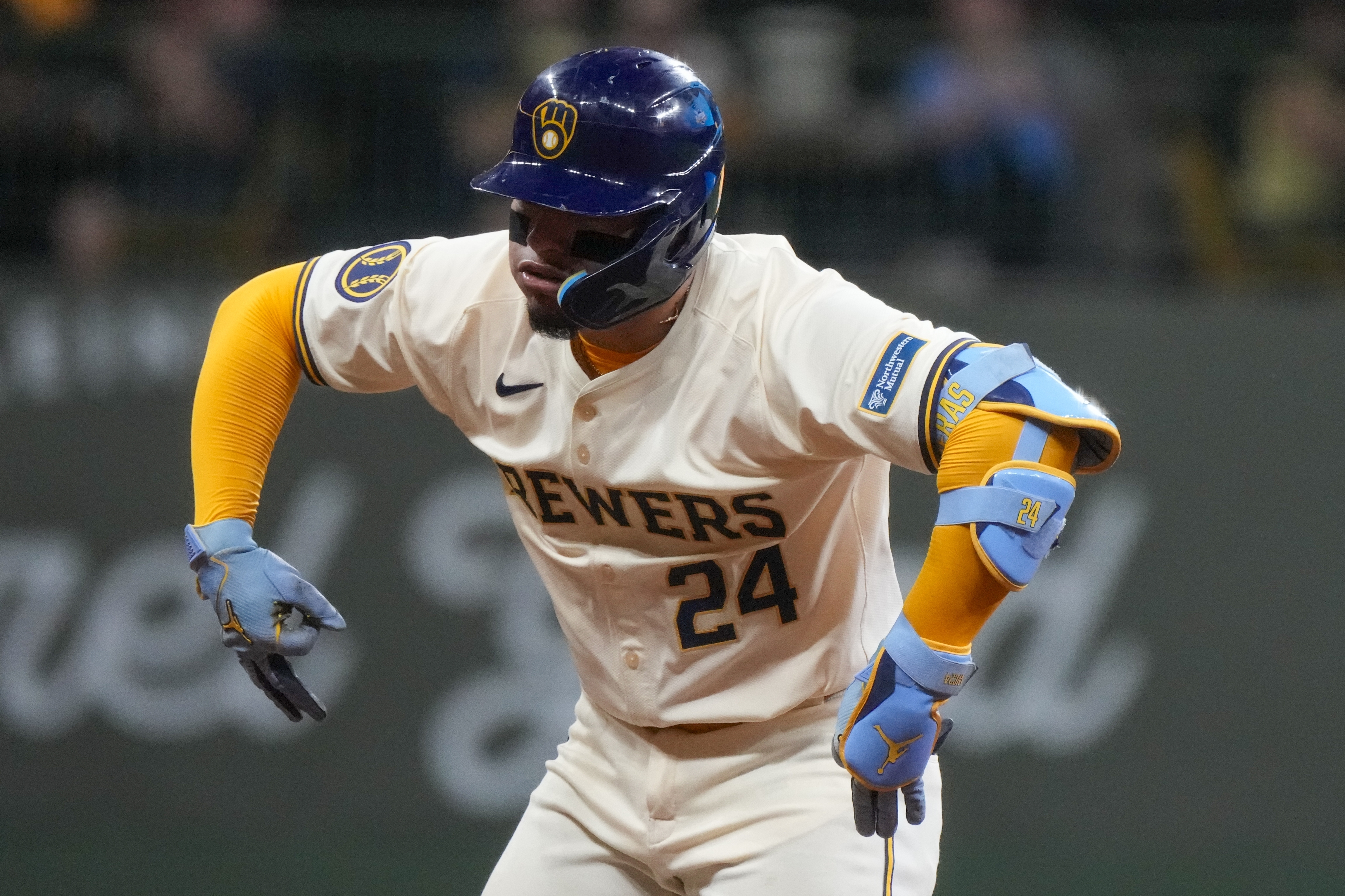Milwaukee Brewers' William Contreras reacts after hitting a two-run scoring double during the third inning of a baseball game against the Philadelphia Phillies Monday, Sept. 16, 2024, in Milwaukee.