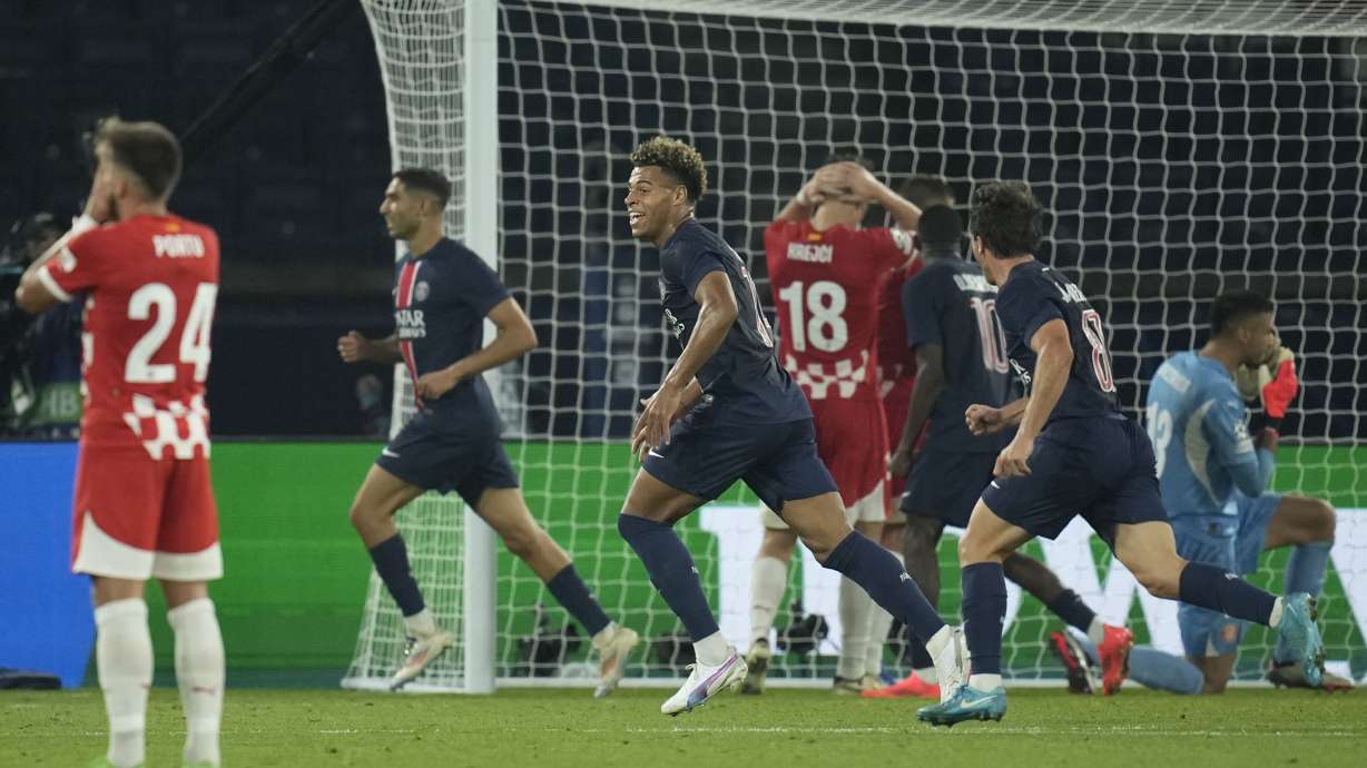 PSG players celebrate after a goal during the Champions League opening phase soccer match between Paris Saint-Germain and Girona at the Parc des Princes stadium in Paris, France, Wednesday, Sept. 18, 2024.