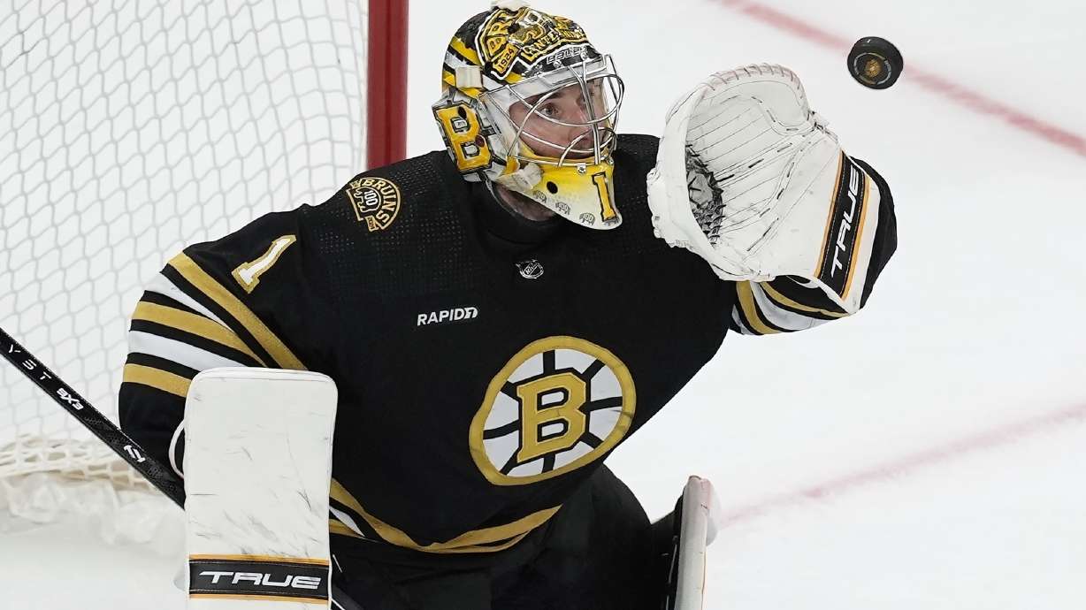 FILE - Boston Bruins' Jeremy Swayman makes a glove save during the third period in Game 6 of an NHL hockey Stanley Cup second-round playoff series against the Florida Panthers, May 17, 2024, in Boston.