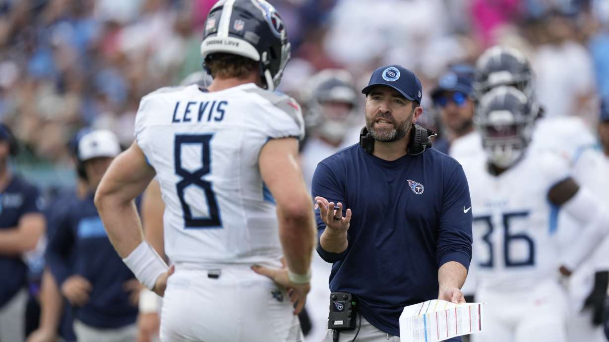 Tennessee Titans coach Brian Callahan speaks with Tennessee Titans quarterback Will Levis (8) in the first half of an NFL football game against the New York Jets in Nashville, Tenn., on Sunday, Sept. 15, 2024.