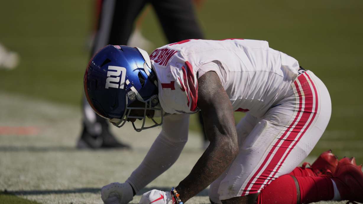 New York Giants wide receiver Malik Nabers (1) reacts after missing a pass on fourth down against the Washington Commanders late in the second half of an NFL football game in Landover, Md., Sunday, Sept. 15, 2024.