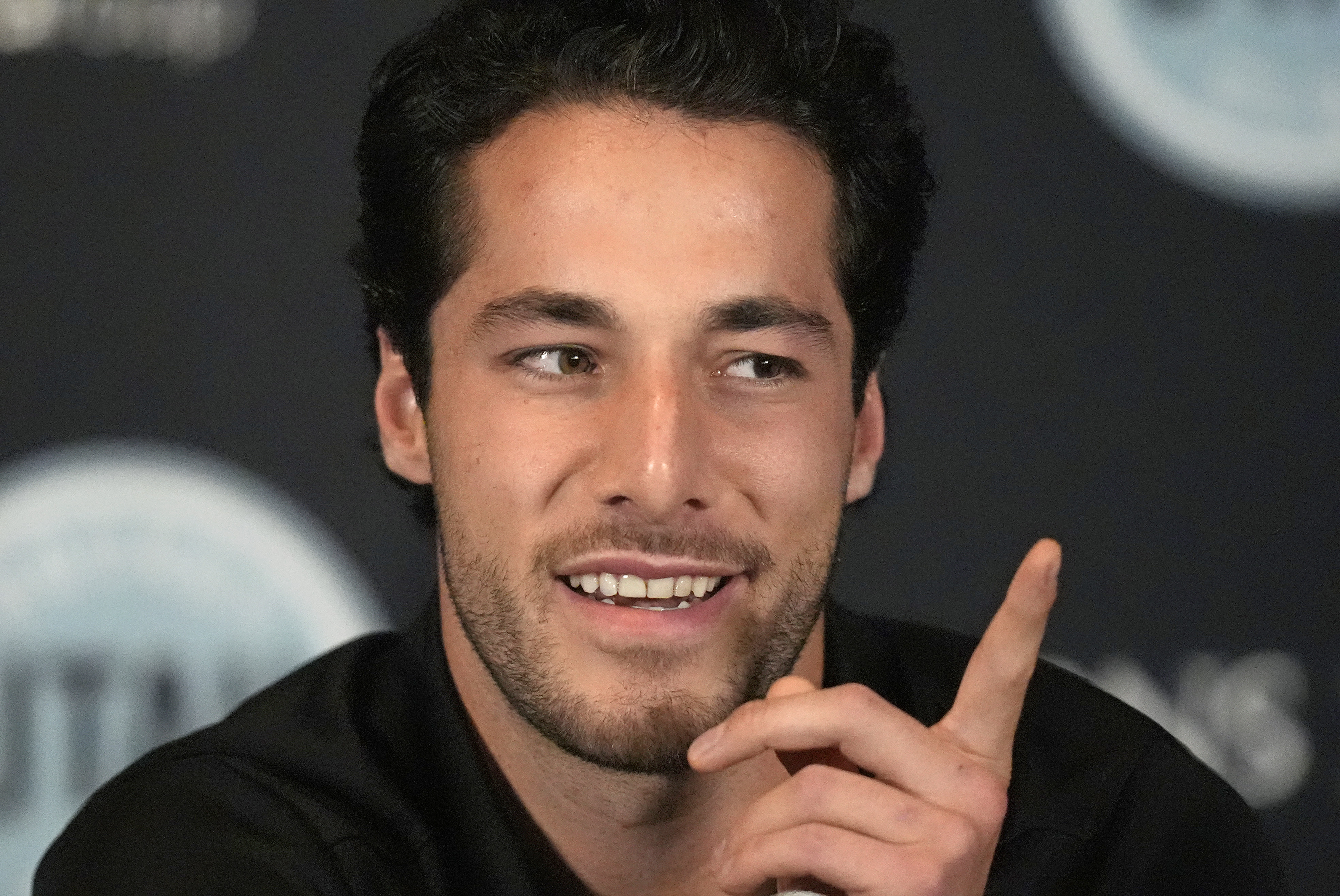 Utah Hockey Club's Sean Durzi speaks during NHL hockey media day Wednesday, Sept. 18, 2024, in Salt Lake City.