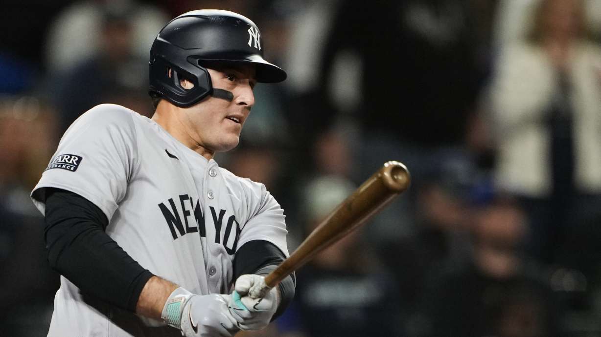 New York Yankees' Anthony Rizzo follows through on an RBI double against the Seattle Mariners during the 10th inning of a baseball game Wednesday, Sept. 18, 2024, in Seattle.