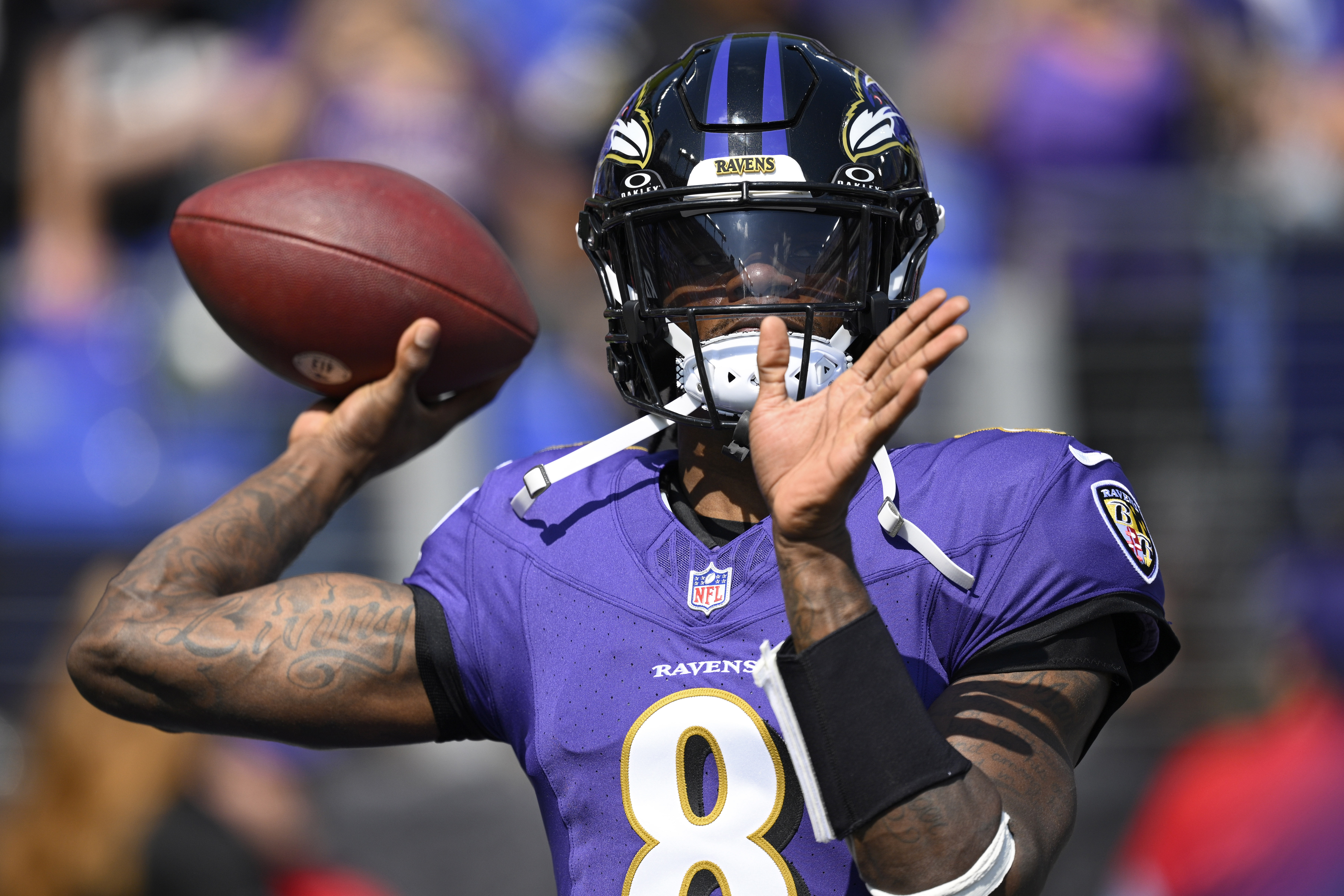 Baltimore Ravens quarterback Lamar Jackson (8) warms up before an NFL football game against the Las Vegas Raiders, Sunday, Sept. 15, 2024, in Baltimore.