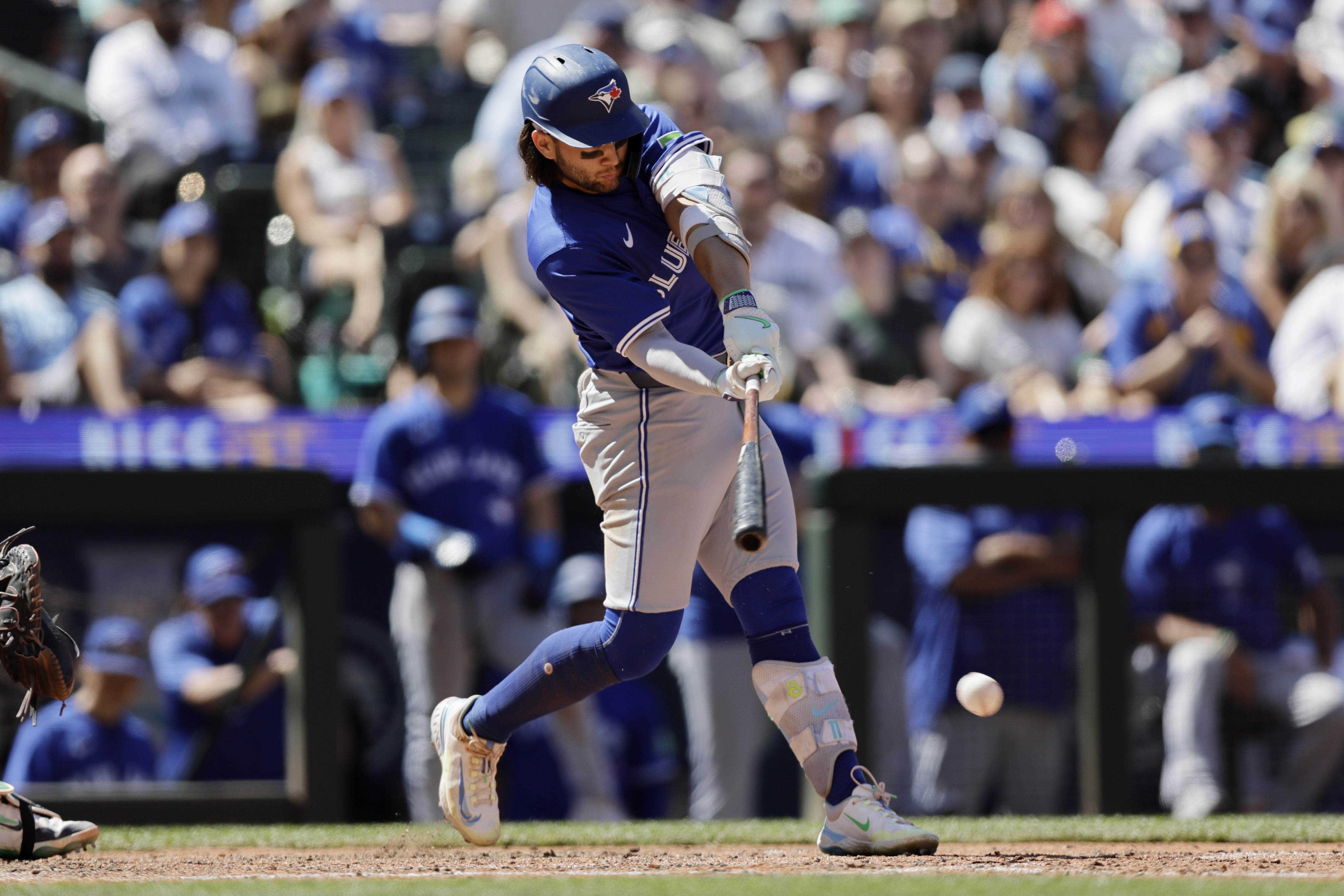 FILE -Toronto Blue Jays' Bo Bichette hits an RBI and reaches base on a fielding error by Seattle Mariners shortstop J.P. Crawford during the eighth inning in a baseball game, Saturday, July 6, 2024, in Seattle.