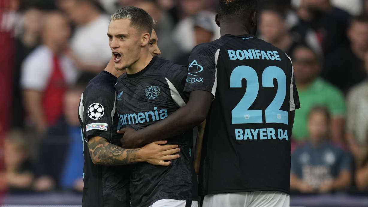 Leverkusen's Florian Wirtz reacts after he scored during the Champions League opening phase soccer match between Feyenoord and Leverkusen in Rotterdam, Netherlands, Thursday, Sept. 19, 2024.