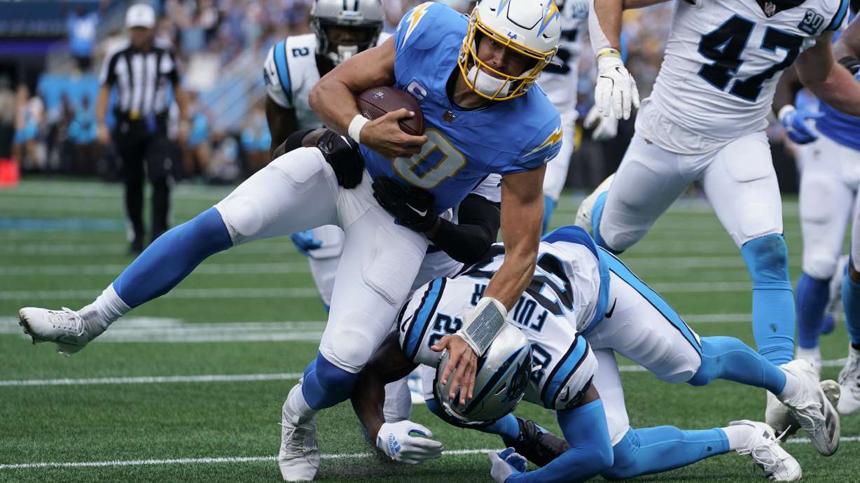 Los Angeles Chargers quarterback Justin Herbert runs against the Carolina Panthers during the first half of an NFL football game on Sunday, Sept. 15, 2024, in Charlotte, N.C.