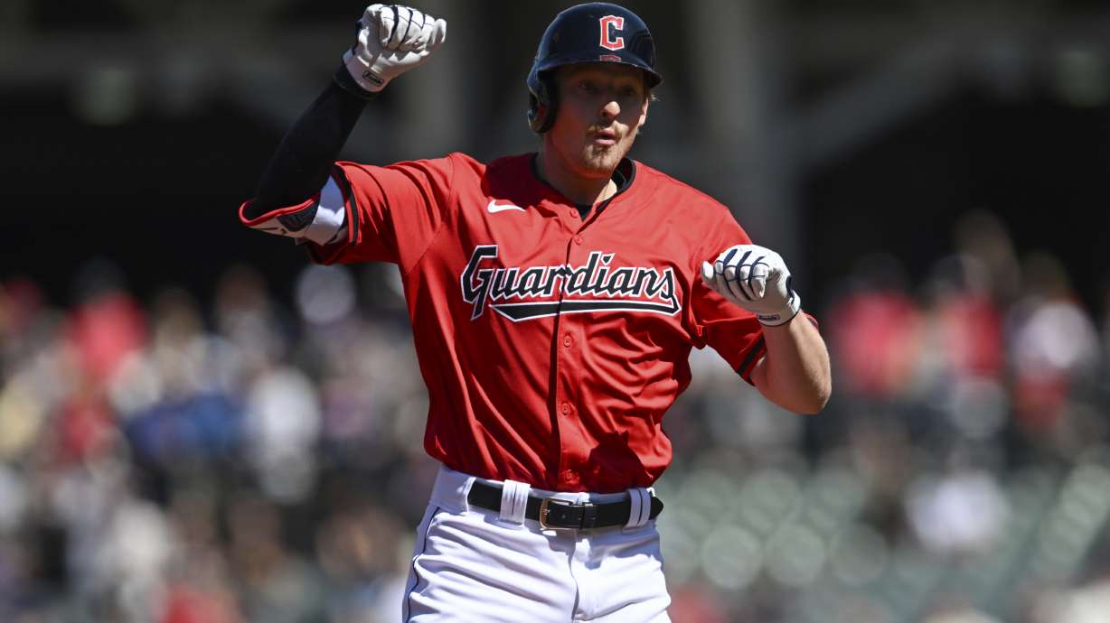 Cleveland Guardians' Kyle Manzardo celebrates hitting a solo home run during the first inning of a baseball game against the Minnesota Twins, Thursday, Sept. 19, 2024, in Cleveland.