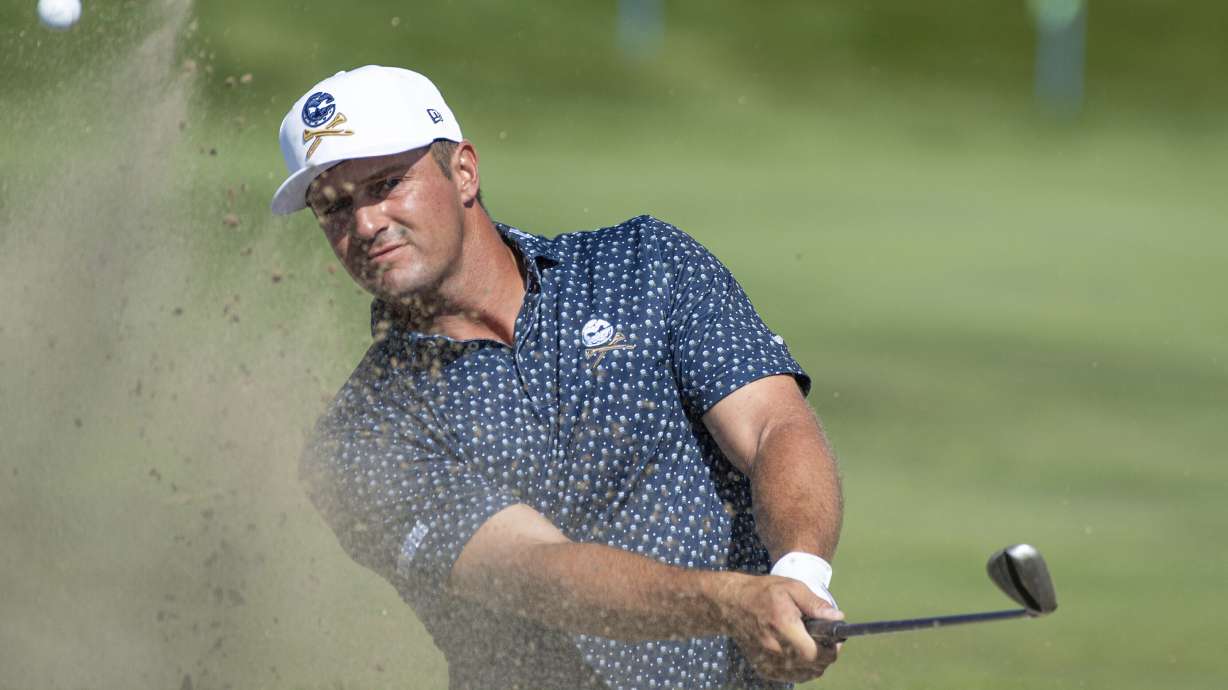 Captain Bryson DeChambeau, of Crushers GC, hits from a bunker on the 12th hole during the first round of LIV Golf Chicago at Bolingbrook Golf Club, Friday, Sept. 13, 2024, in Bolingbrook, Ill.