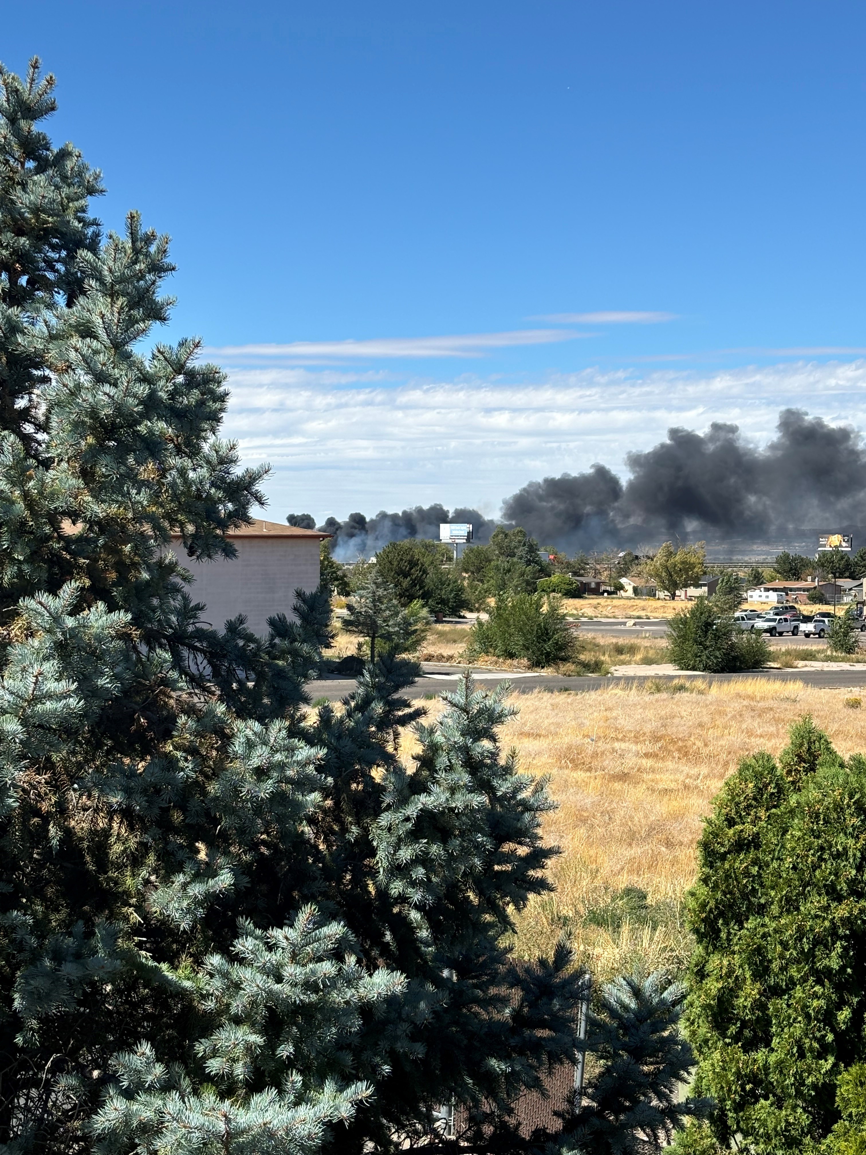 Smoke billows from a fire burning near the airport in Cedar City Thursday afternoon.