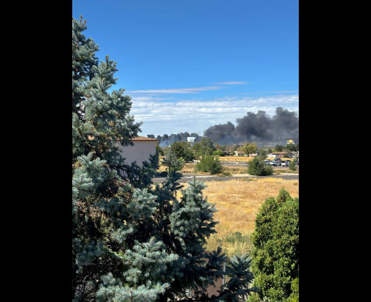 Smoke billows from a fire burning near the airport in Cedar City Thursday afternoon.
