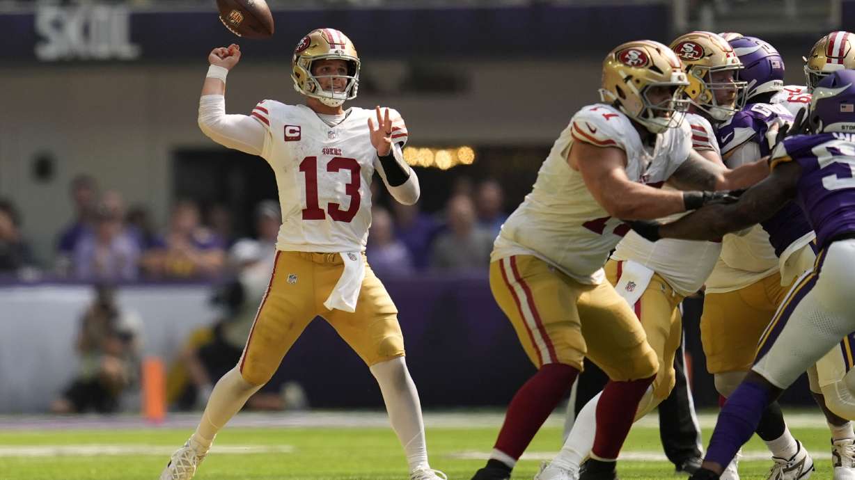 San Francisco 49ers quarterback Brock Purdy (13) fumbles the ball during the second half of an NFL football game against the Minnesota Vikings, Sunday, Sept. 15, 2024, in Minneapolis.