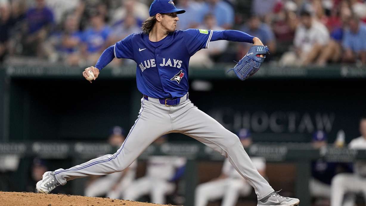 Toronto Blue Jays starting pitcher Kevin Gausman throws to the Texas Rangers in the fifth inning of a baseball game in Arlington, Texas, Thursday, Sept. 19, 2024.