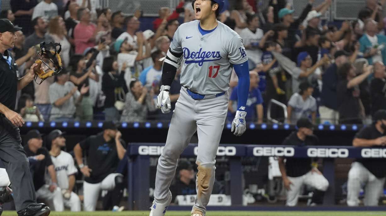 Los Angeles Dodgers' Shohei Ohtani (17) reacts after hitting his 50th home run of the season during the seventh inning of a baseball game against the Miami Marlins, Thursday, Sept. 19, 2024, in Miami.