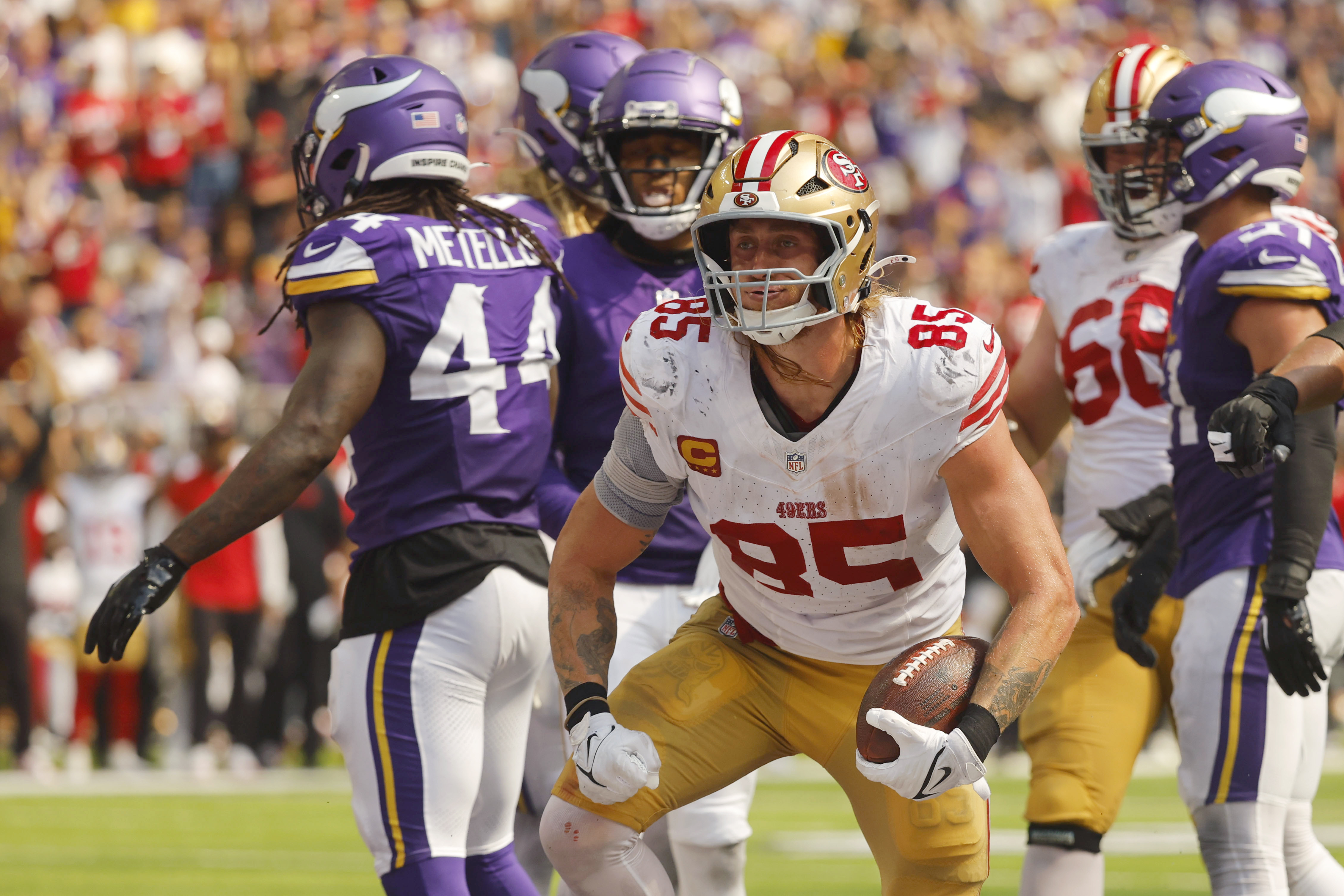 San Francisco 49ers tight end George Kittle (85) celebrates after catching a 7-yard touchdown pass during the first half of an NFL football game against the Minnesota Vikings, Sunday, Sept. 15, 2024, in Minneapolis.