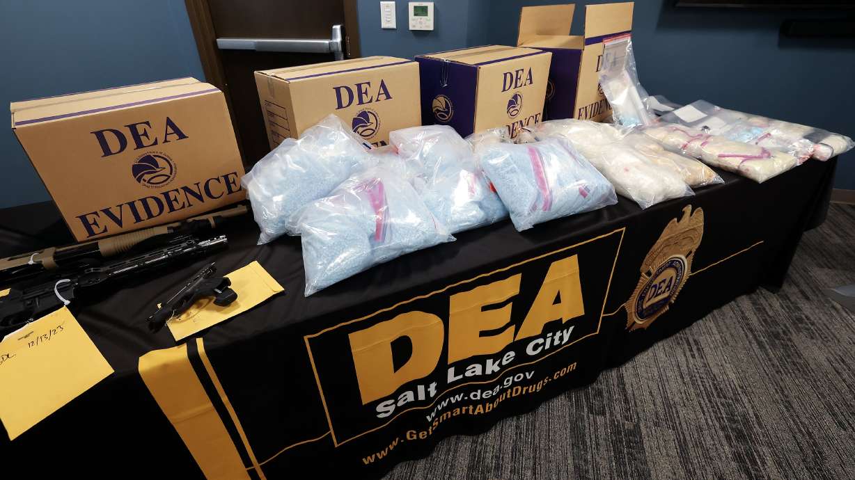 Seized weapons and drugs, including around 230,000 fentanyl pills, cocaine, methamphetamine and black tar heroin, are on display in Salt Lake City on July 25. Fentanyl accounted for nearly half of Utah’s overdose deaths in 2023.