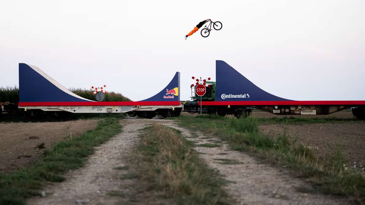 Professional mountain biker Dawid Godziek just made history with a death-defying bike run on a moving train.