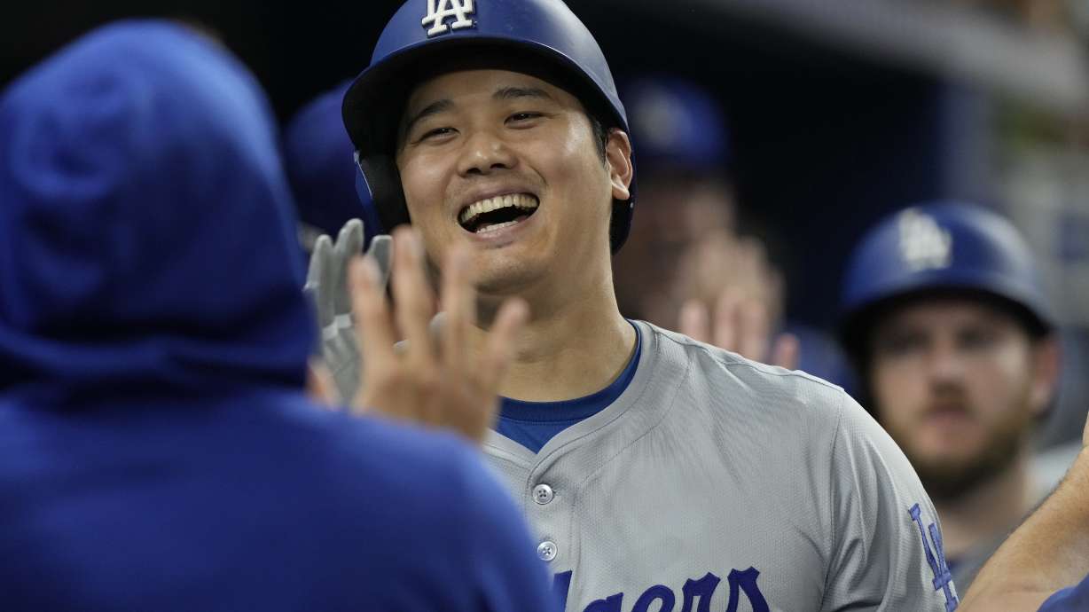 Los Angeles Dodgers' Shohei Ohtani (17) celebrates his 51 home run of the season during the ninth inning of a baseball game against the Miami Marlins, Thursday, Sept. 19, 2024, in Miami.