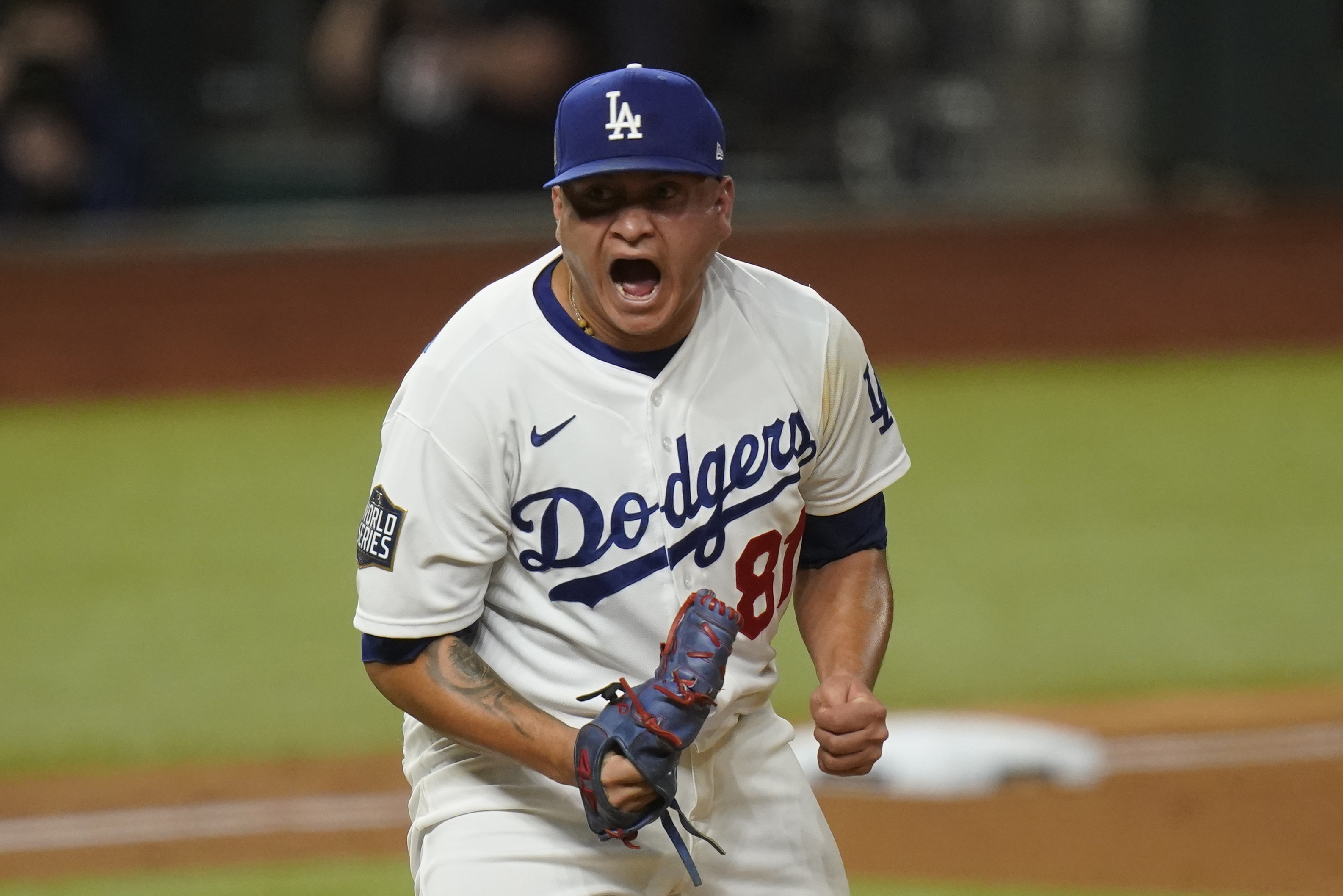 FILE - Los Angeles Dodgers pitcher Victor Gonzalez celebrates after striking out the side against the Tampa Bay Rays during the sixth inning in Game 6 of the baseball World Series Tuesday, Oct. 27, 2020, in Arlington, Texas.