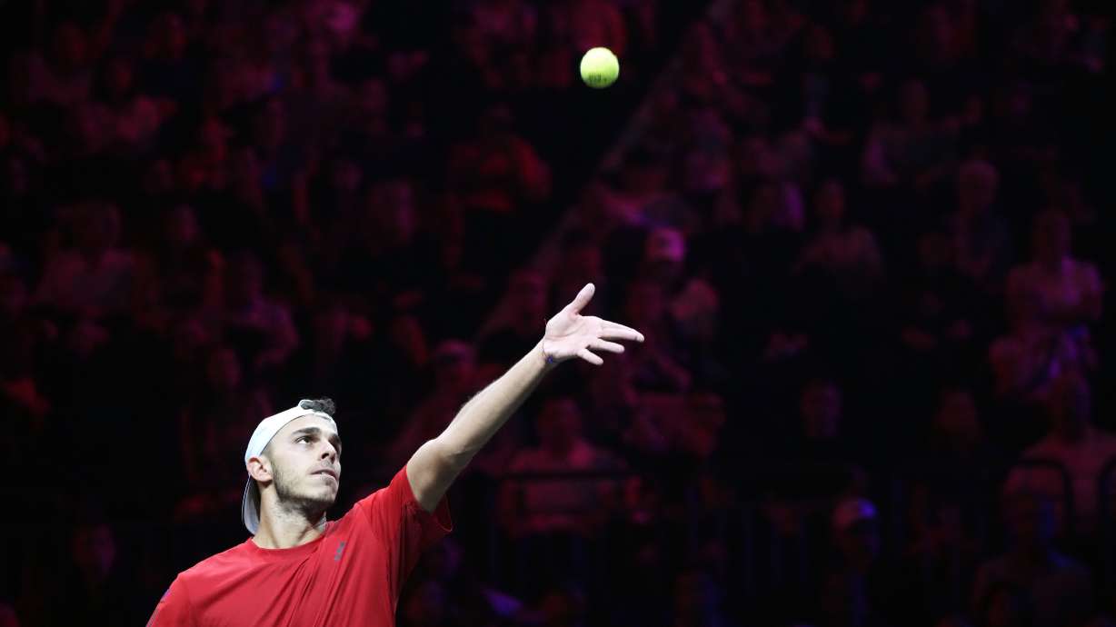 Team World's Francisco Cerundolo tosses the ball for a serve to Europe's Casper Ruud during his singles tennis match on the first day of the Laver Cup tennis tournament at the Uber arena in Berlin, Germany, Friday, Sept. 20, 2024.