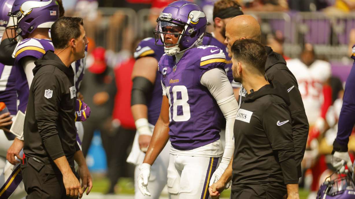 Minnesota Vikings wide receiver Justin Jefferson (18) is helped off the field after getting injured during the second half of an NFL football game against the San Francisco 49ers, Sunday, Sept. 15, 2024, in Minneapolis.