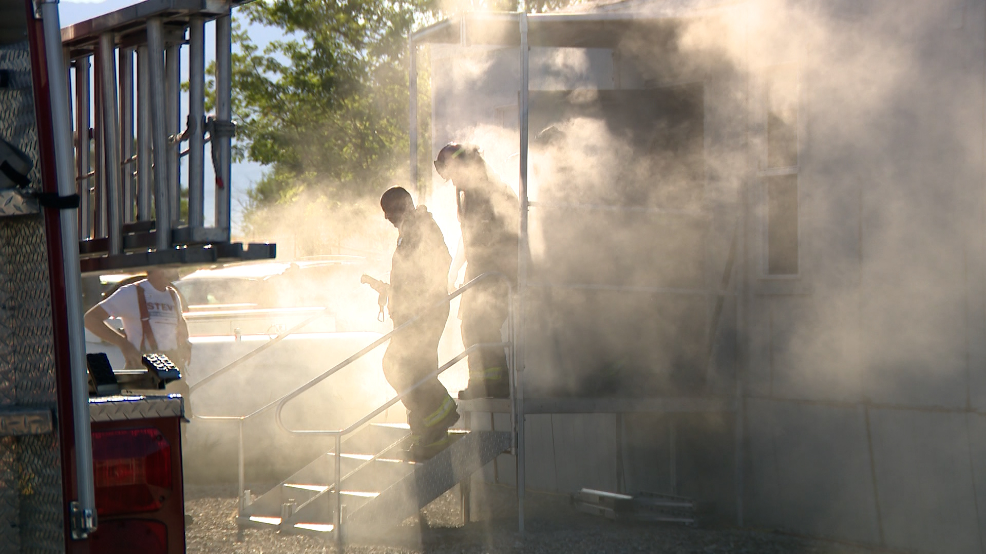 The trainees came out of the smoke-filled building.