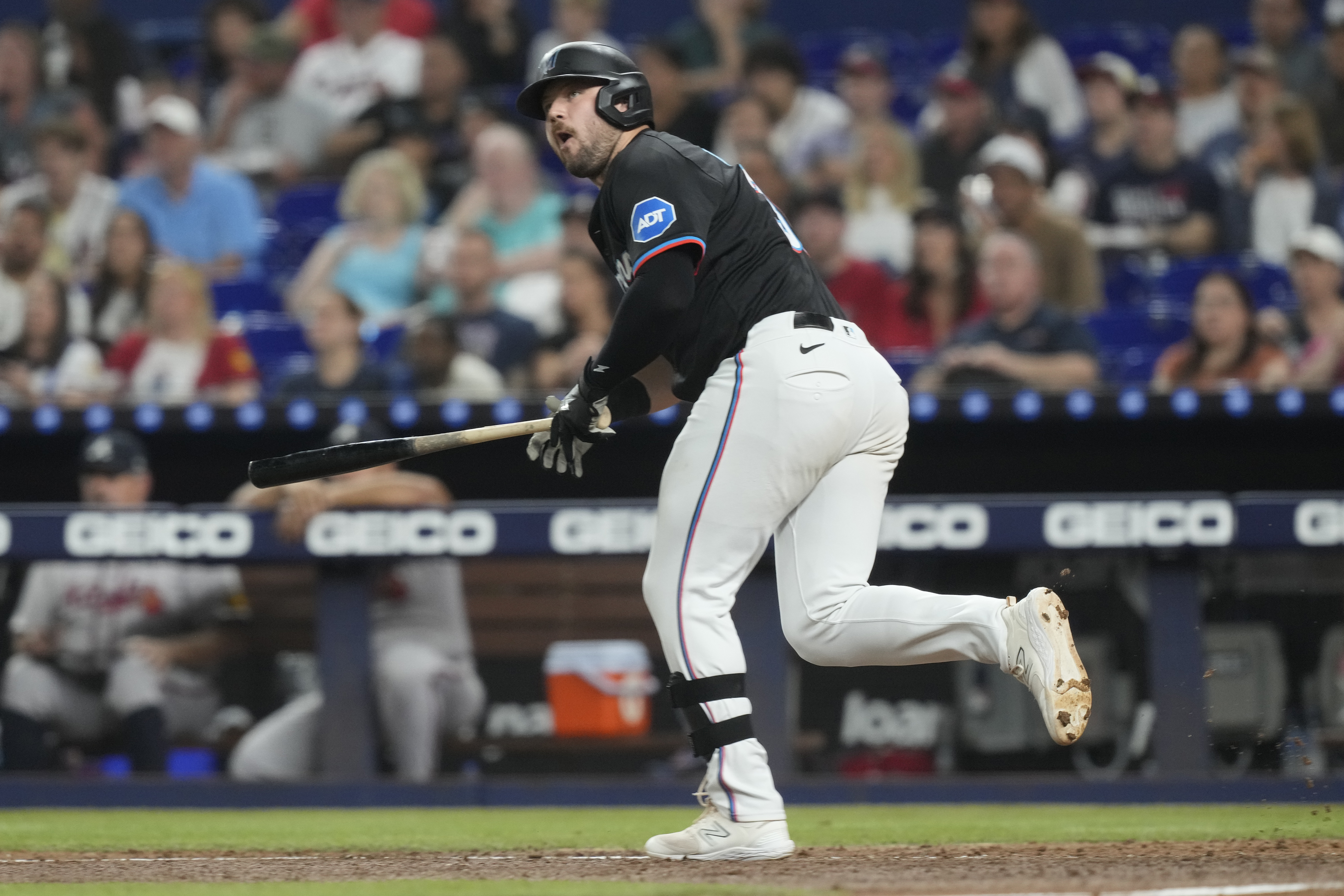Miami Marlins' Jake Burger (36) hits a single to left field during the third inning of a baseball game against the Atlanta Braves, Friday, Sept. 20, 2024, in Miami.