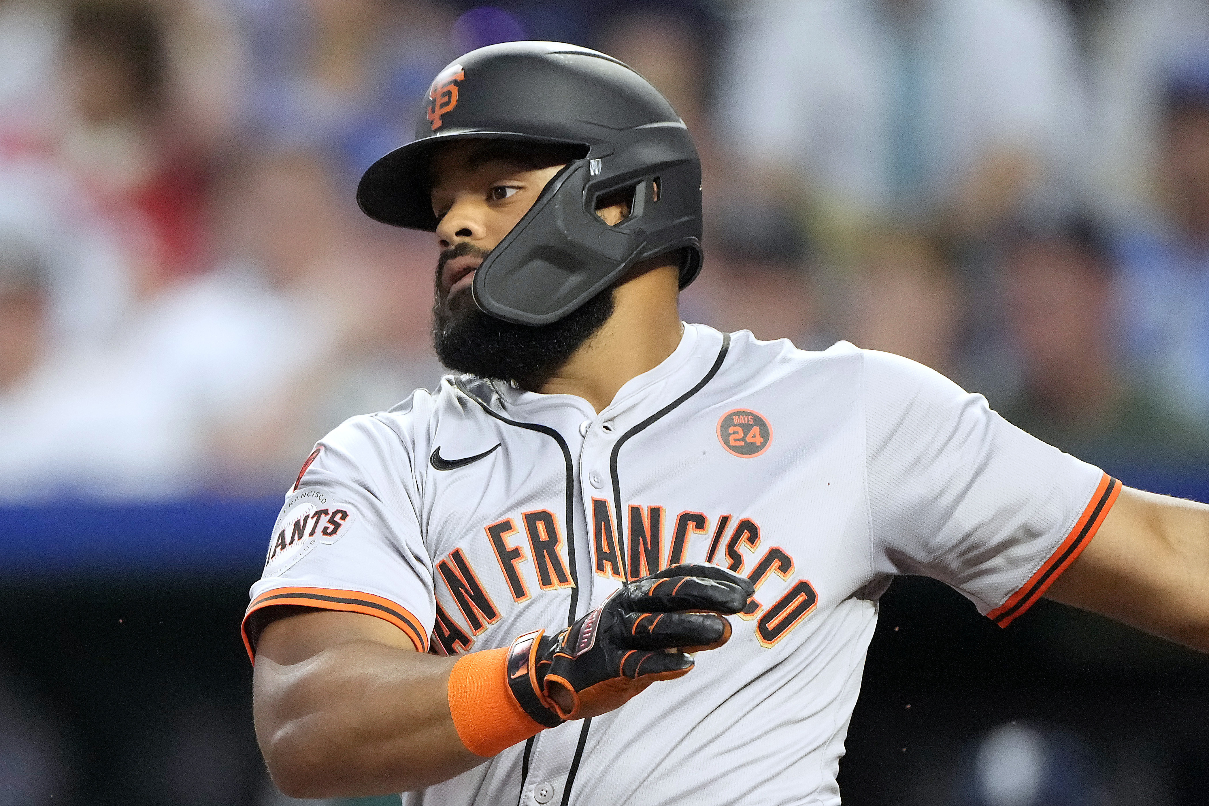 San Francisco Giants' Heliot Ramos watches his RBI single during the first inning of a baseball game against the Kansas City Royals Friday, Sept. 20, 2024, in Kansas City, Mo.