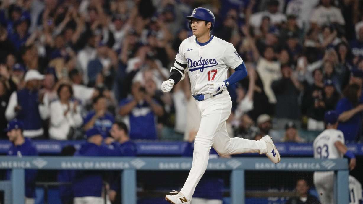 Los Angeles Dodgers designated hitter Shohei Ohtani (17) runs the bases after hitting a home run during the fifth inning of a baseball game against the Colorado Rockies in Los Angeles, Friday, Sept. 20, 2024. Max Muncy also scored.