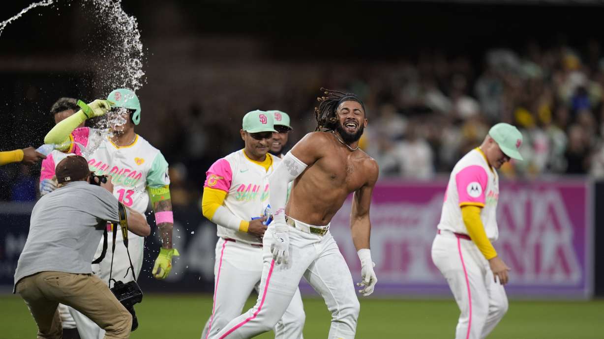 San Diego Padres' Fernando Tatis Jr. is doused after hitting a walk off double during the tenth inning of a baseball game to defeat the Chicago White Sox 3-2, Friday, Sept. 20, 2024, in San Diego.