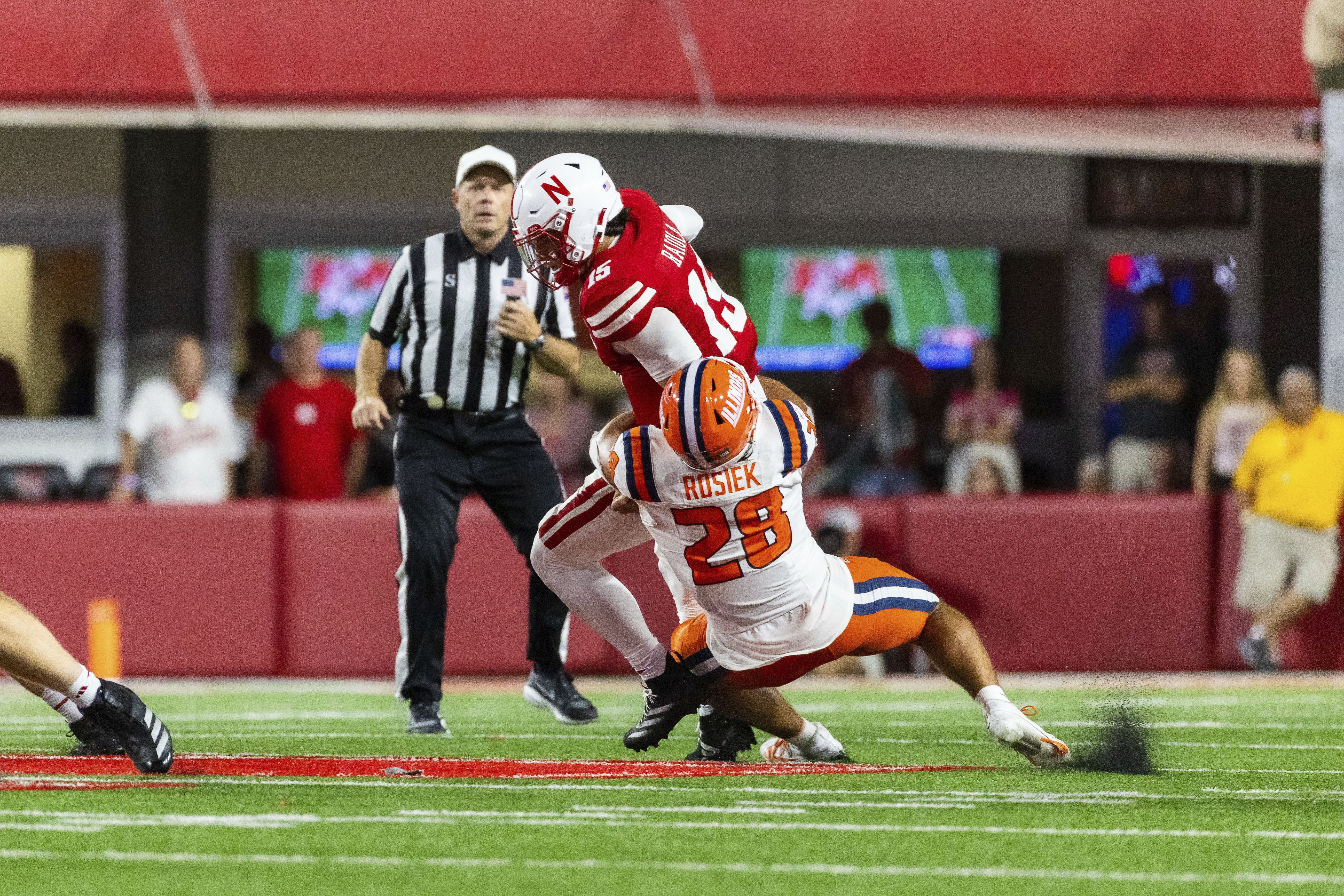 Nebraska quarterback Dylan Raiola (15) is sacked by Illinois linebacker Dylan Rosiek (28) during overtime of an NCAA college football game, Friday, Sept. 20, 2024, in Lincoln, Neb. 