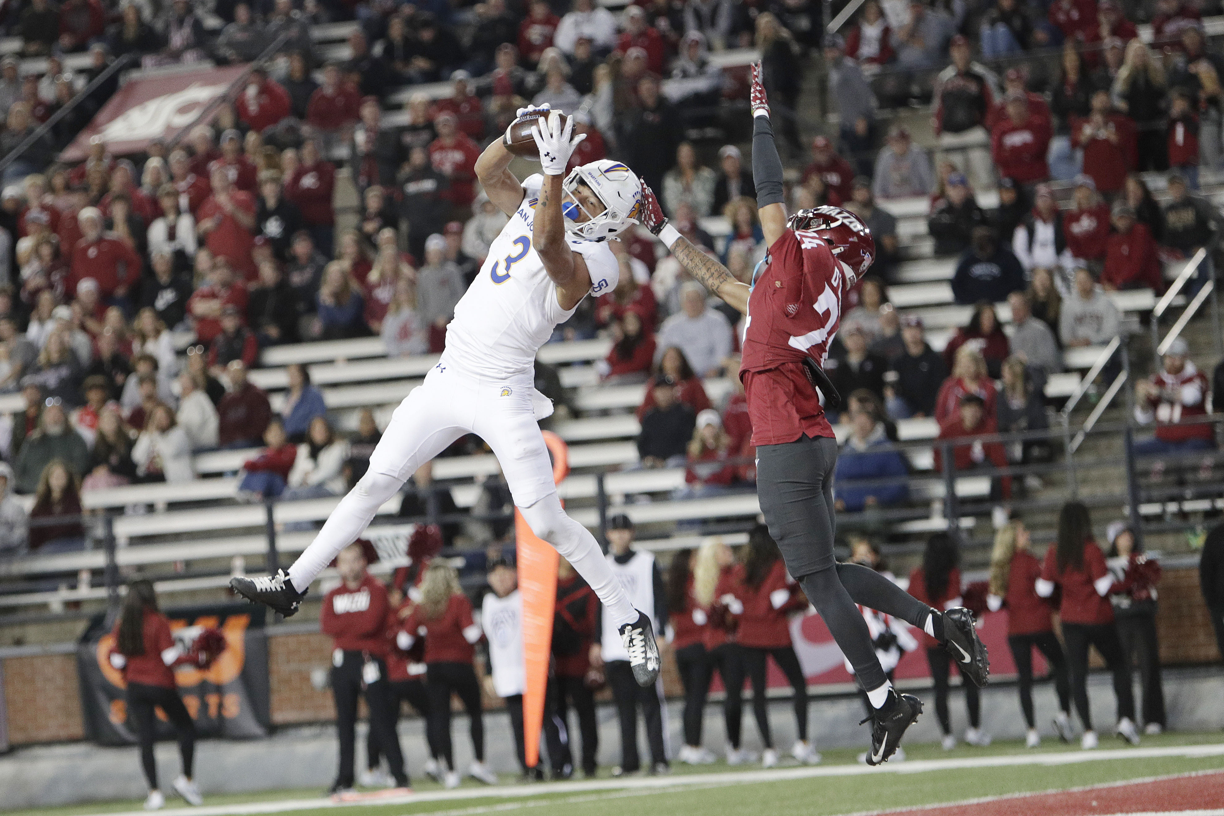 San Jose State wide receiver Nick Nash (3) catches a pass for a touchdown while pressured by Washington State defensive back Ethan O'Connor (24) during the second half of an NCAA college football game, Friday, Sept. 20, 2024, in Pullman, Wash. 
