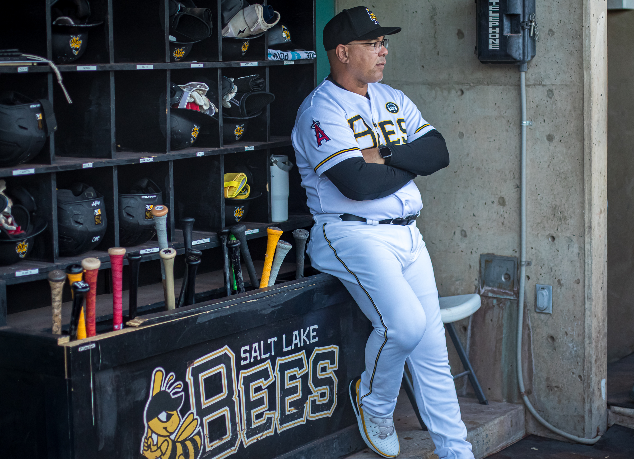 Salt Lake Bees manager Keith Johnson stands in the Smith's Ballpark dugout before a game against Oklahoma City on Thursday. Johnson has been a player and coach at Smith's Ballpark/