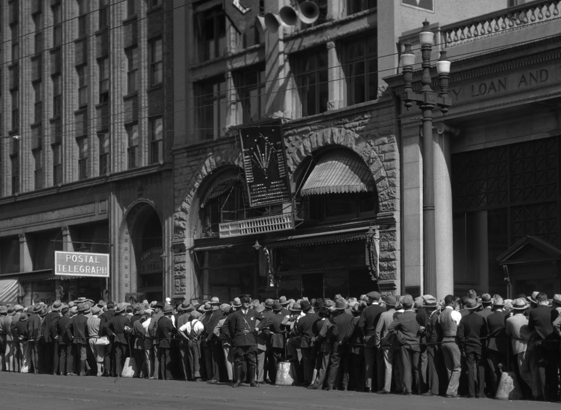 Baseball fans gather outside the Salt Lake Tribune building on Oct. 7, 1928, to view a scoreboard displaying the live score of a World Series game between the New York Yankees and St. Louis Cardinals. These types of events are how people kept track of games before radio and television broadcasts became the normal.