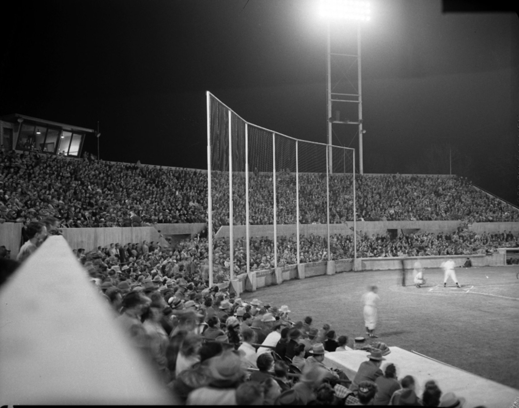 Fans watch a baseball game at Derks Field sometime between 1948 and 1950.