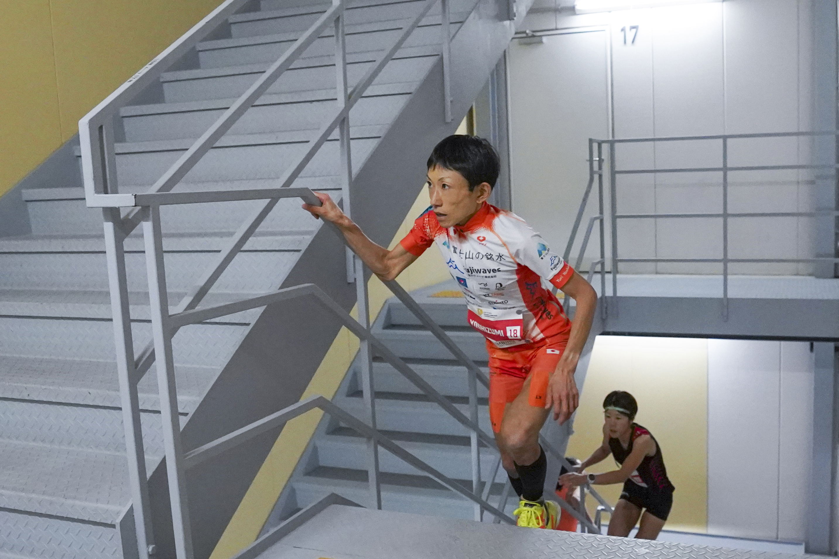 In this photo provided by ISF/Meeting, runner Yuri Yoshizumi competes during a race of Stairclimbing World Championships in Osaka, western Japan, on Nov. 19, 2023.