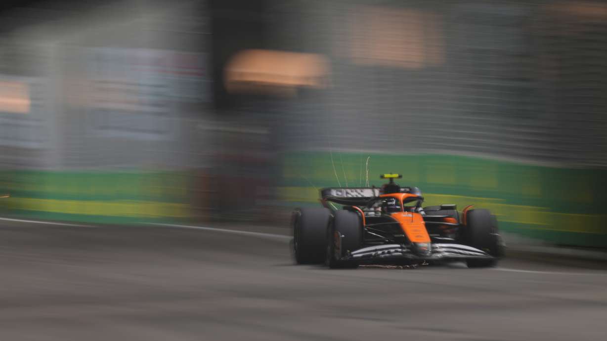 McLaren driver Lando Norris of Britain steers his car during the qualifying session of the Singapore Formula One Grand Prix at the Marina Bay Street Circuit, in Singapore, Saturday, Sept. 21, 2024.