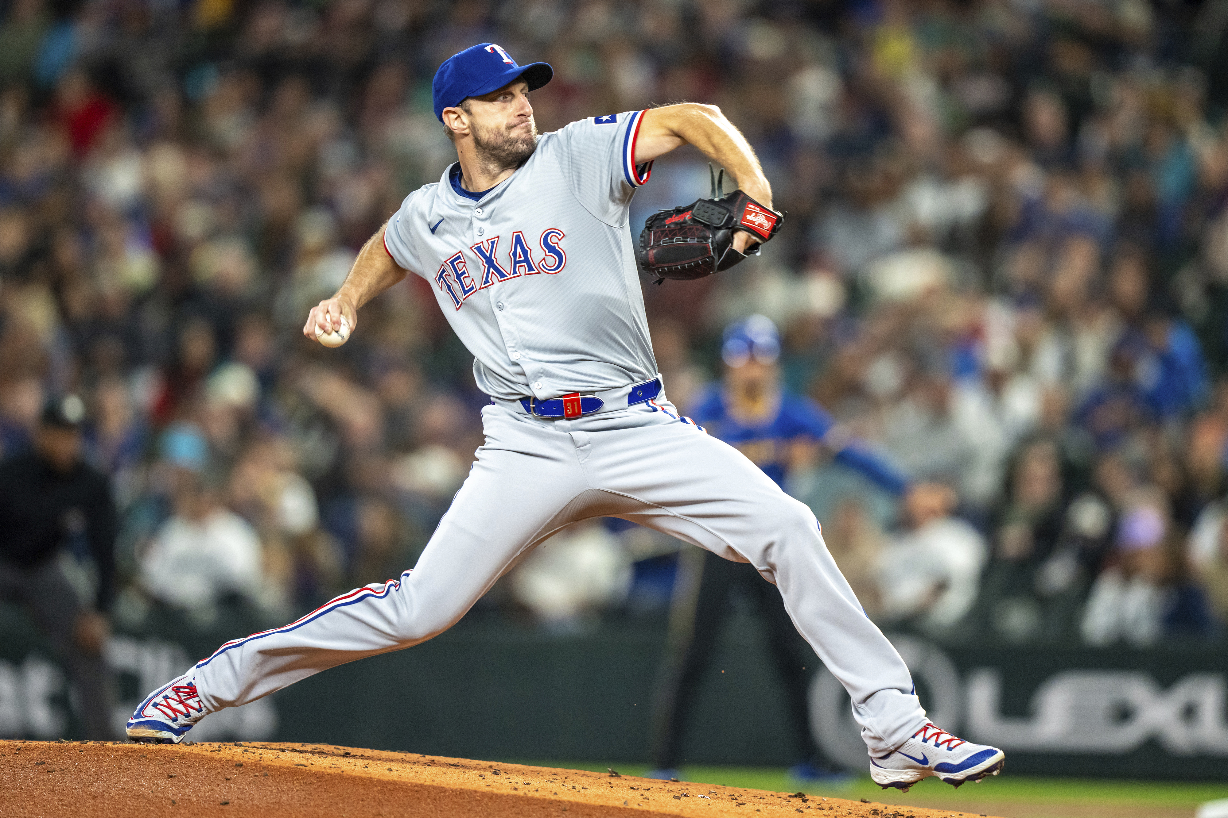 Texas Rangers starter Max Scherzer delivers a pitch during the first inning of a baseball game against the Texas Rangers, Saturday, Sept. 14, 2024, in Seattle. 