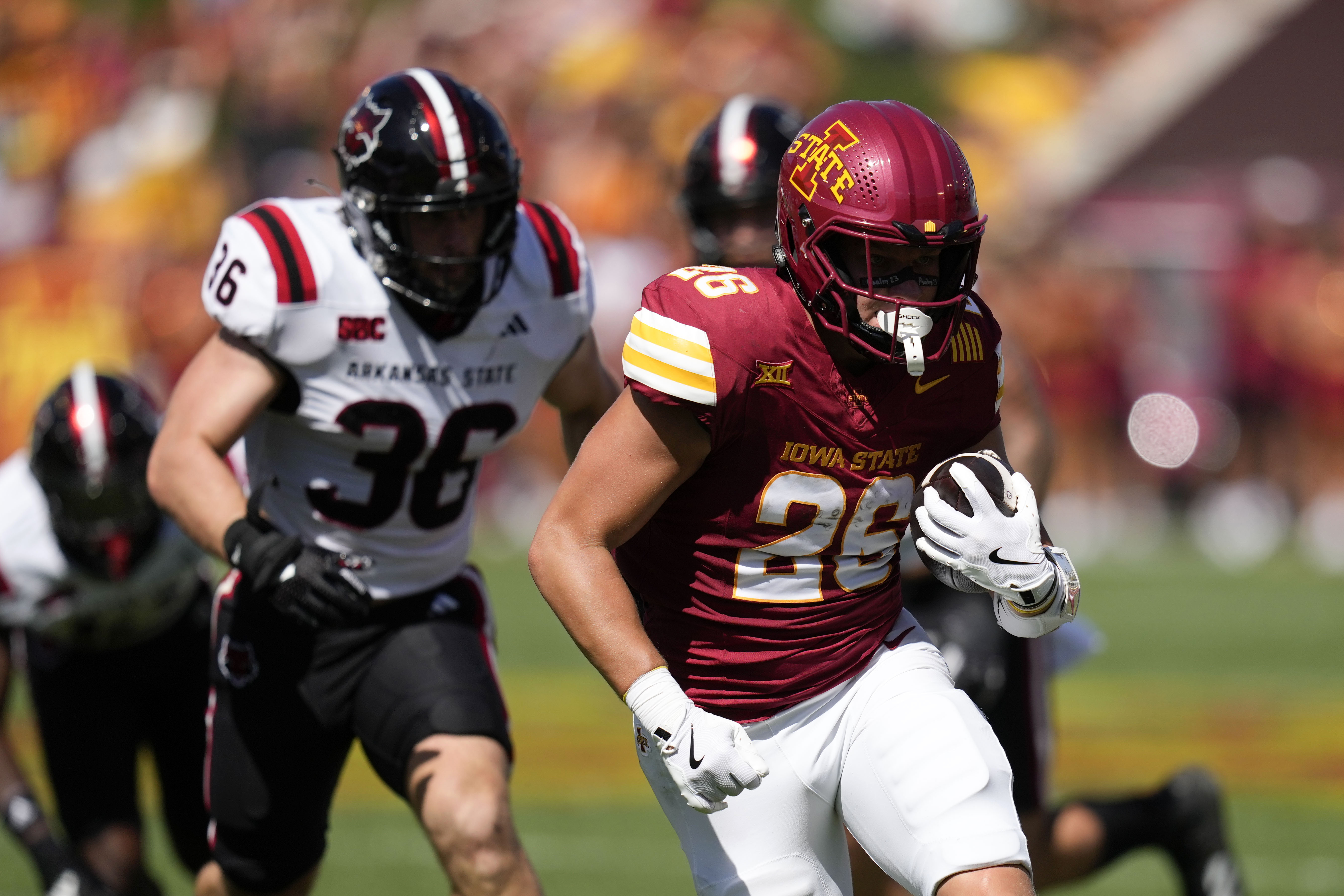 Rocco Becht has hand in 3 TDs, No. 20 Cyclones run off to a 52-7 win over Arkansas St.