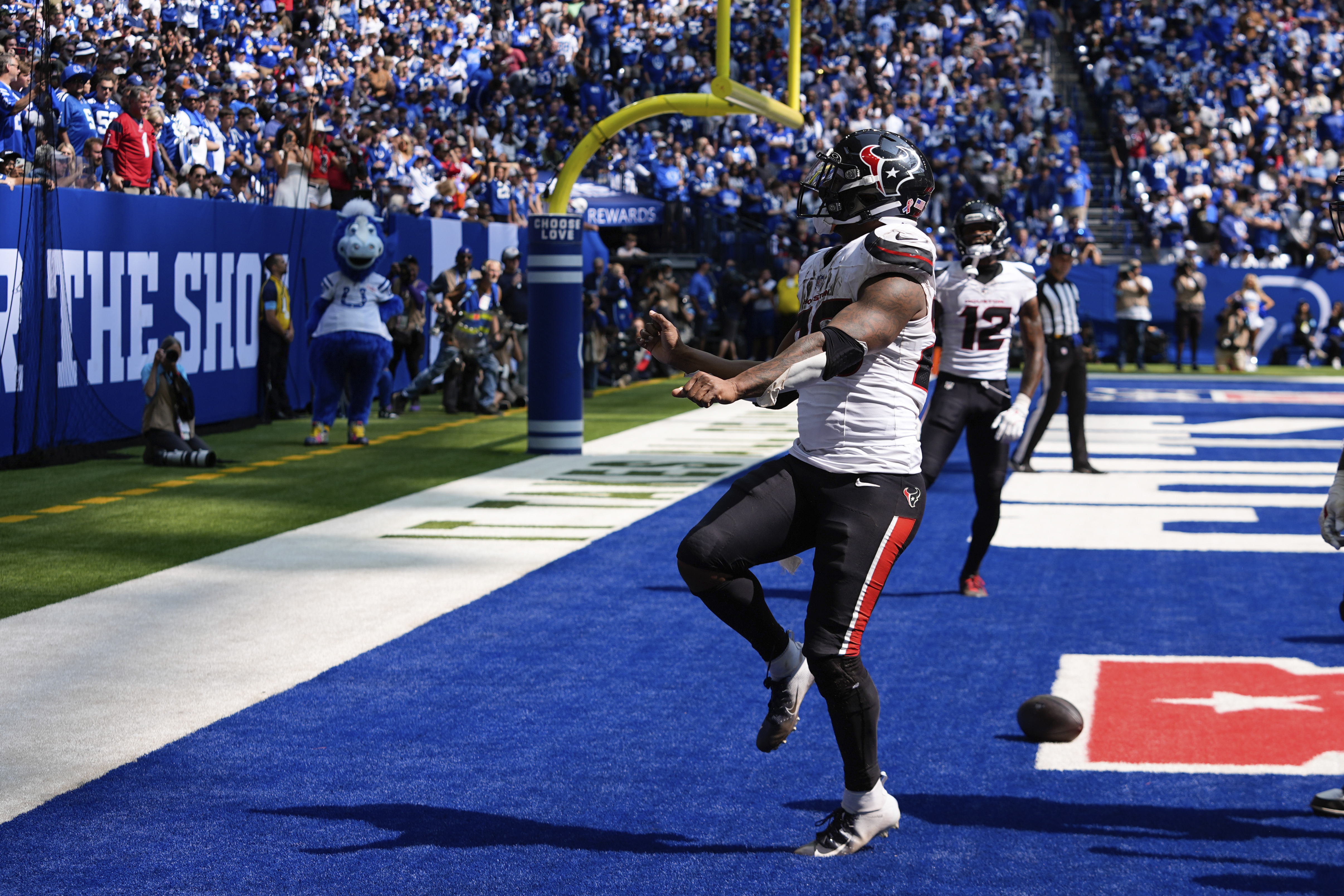 Houston Texans running back Joe Mixon (28) celebrates a touchdown during the second half of an NFL football game against the Indianapolis Colts, Sunday, Sept. 8, 2024, in Indianapolis. 