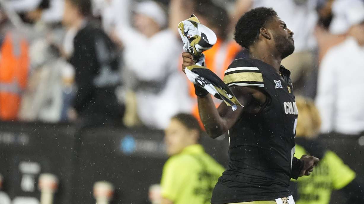 Colorado quarterback Shedeur Sanders celebrates after an overtime victory over Baylor in an NCAA college football game Saturday, Sept. 21, 2024, in Boulder, Colo.