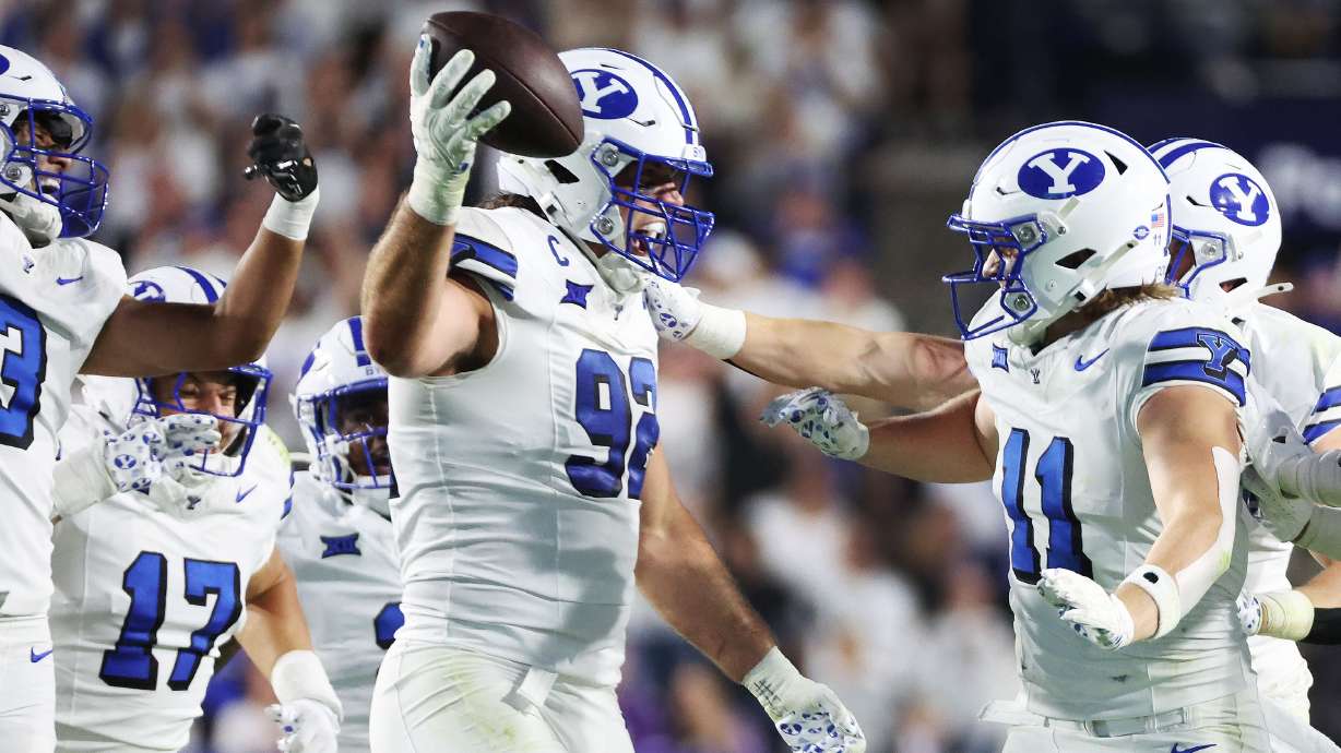 Brigham Young Cougars defensive end Tyler Batty (92) celebrates his interception against Kansas State Wildcats in Provo on Saturday, Sept. 21, 2024.