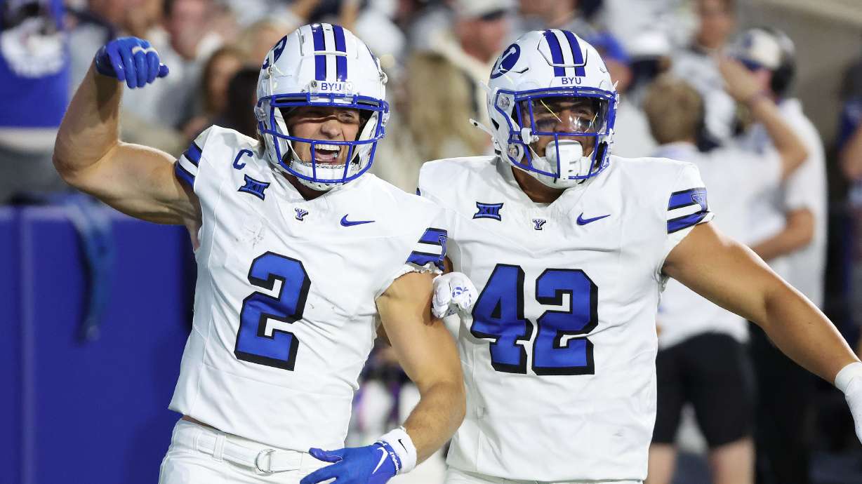 Brigham Young Cougars wide receiver Chase Roberts (2) celebrates his touchdown with Brigham Young Cougars tight end Ray Paulo (42) against Kansas State Wildcats in Provo on Saturday, Sept. 21, 2024.