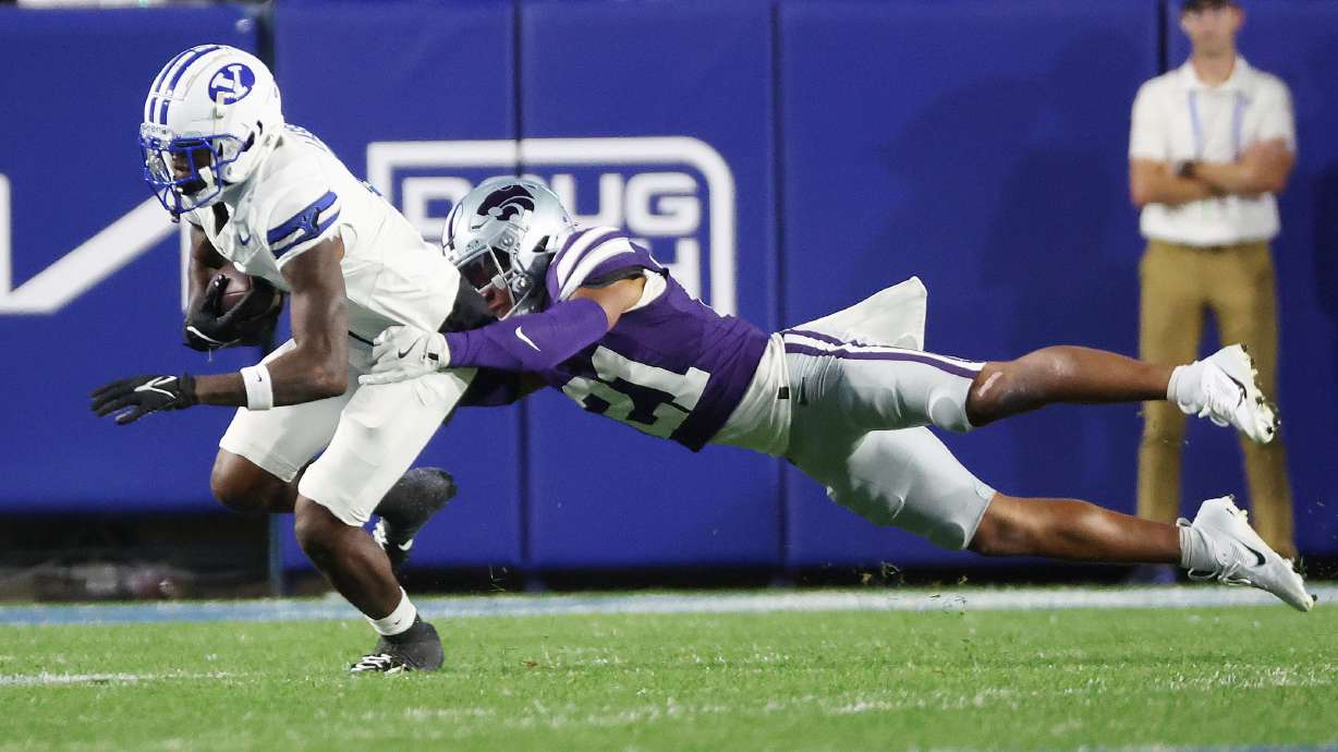 Brigham Young Cougars wide receiver Darius Lassiter (5) runs after a catch against Kansas State Wildcats safety Marques Sigle (21) in Provo on Saturday, Sept. 21, 2024. BYU won 38-9.