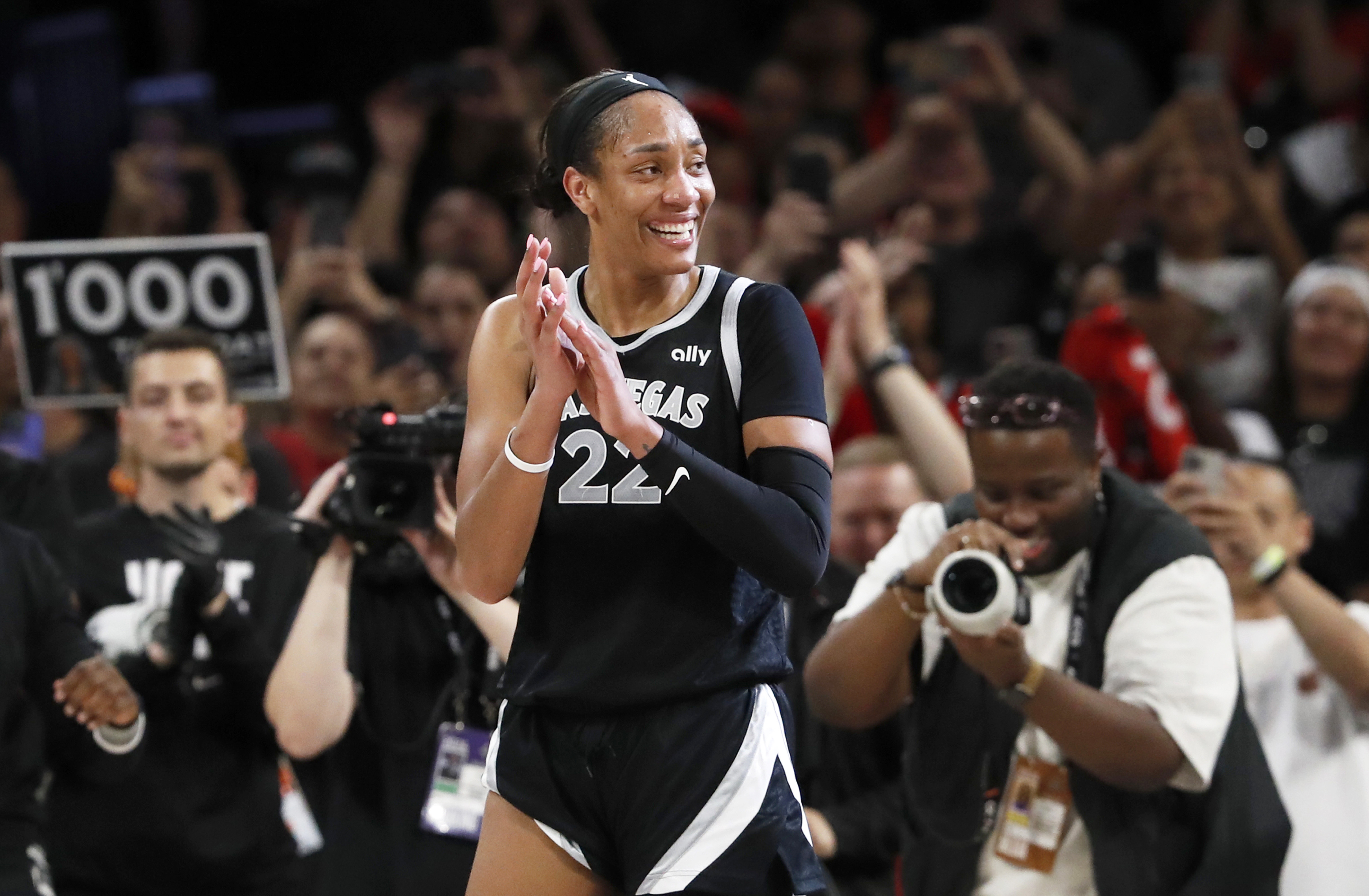 Las Vegas Aces center A'ja Wilson (22) celebrates during the second half of a WNBA basketball game against the Connecticut Sun, Sunday, Sept. 15, 2024, in Las Vegas. 