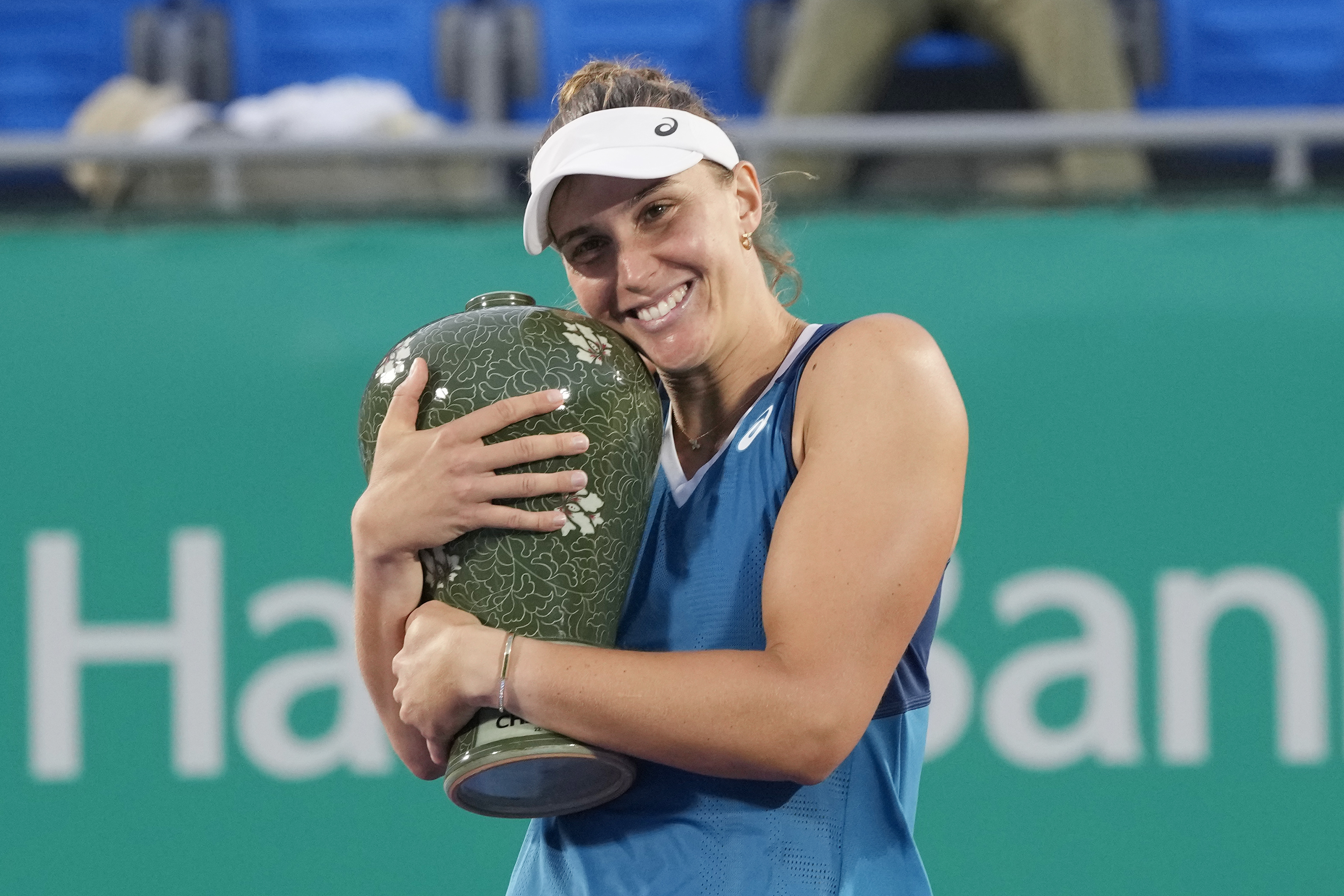 Beatriz Haddad Maia of Brazil holds her trophy after defeating Daria Kasatkina of Russia during their final match of the Korea Open tennis championships at Olympic Park Tennis Court in Seoul, South Korea, Sunday, Sept. 22, 2024. 