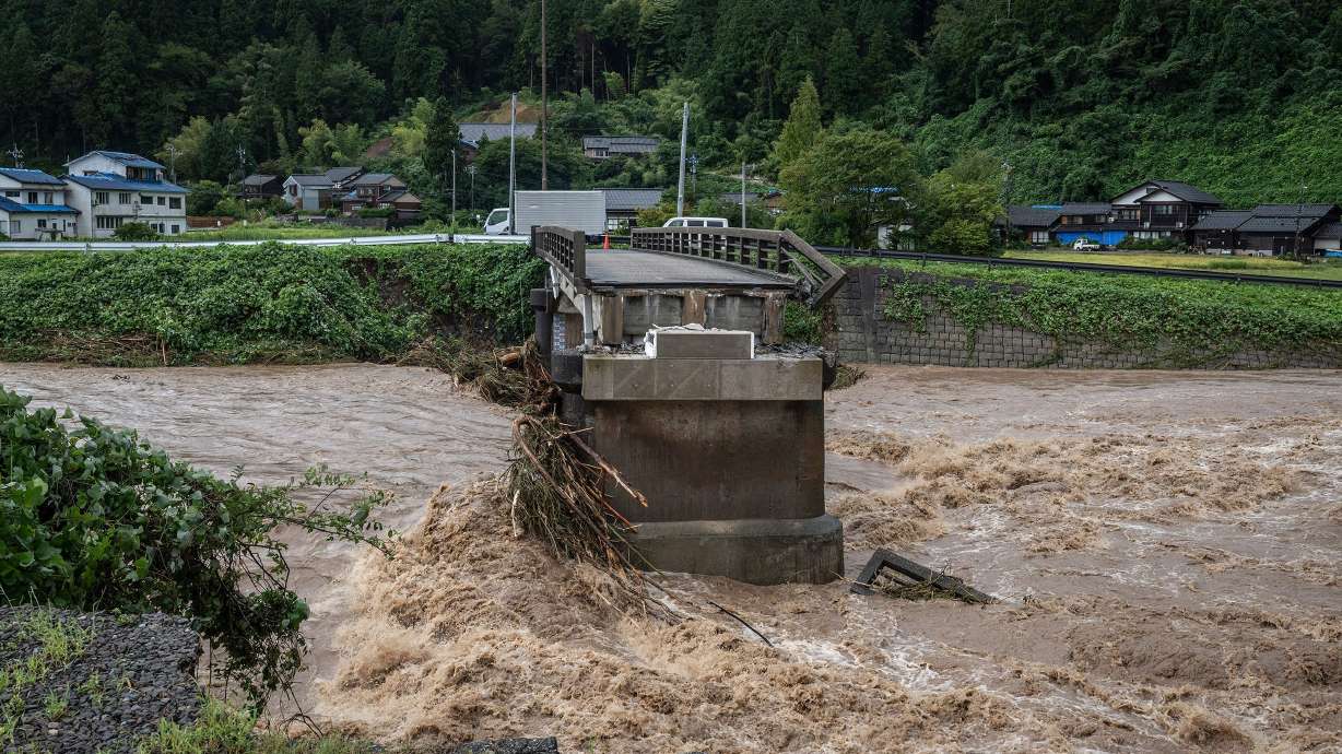 A collapsed bridge is seen following heavy rain in Wajima city, Ishikawa prefecture on Sunday. The region of Japan faces flooding while still recovering from an earthquake.