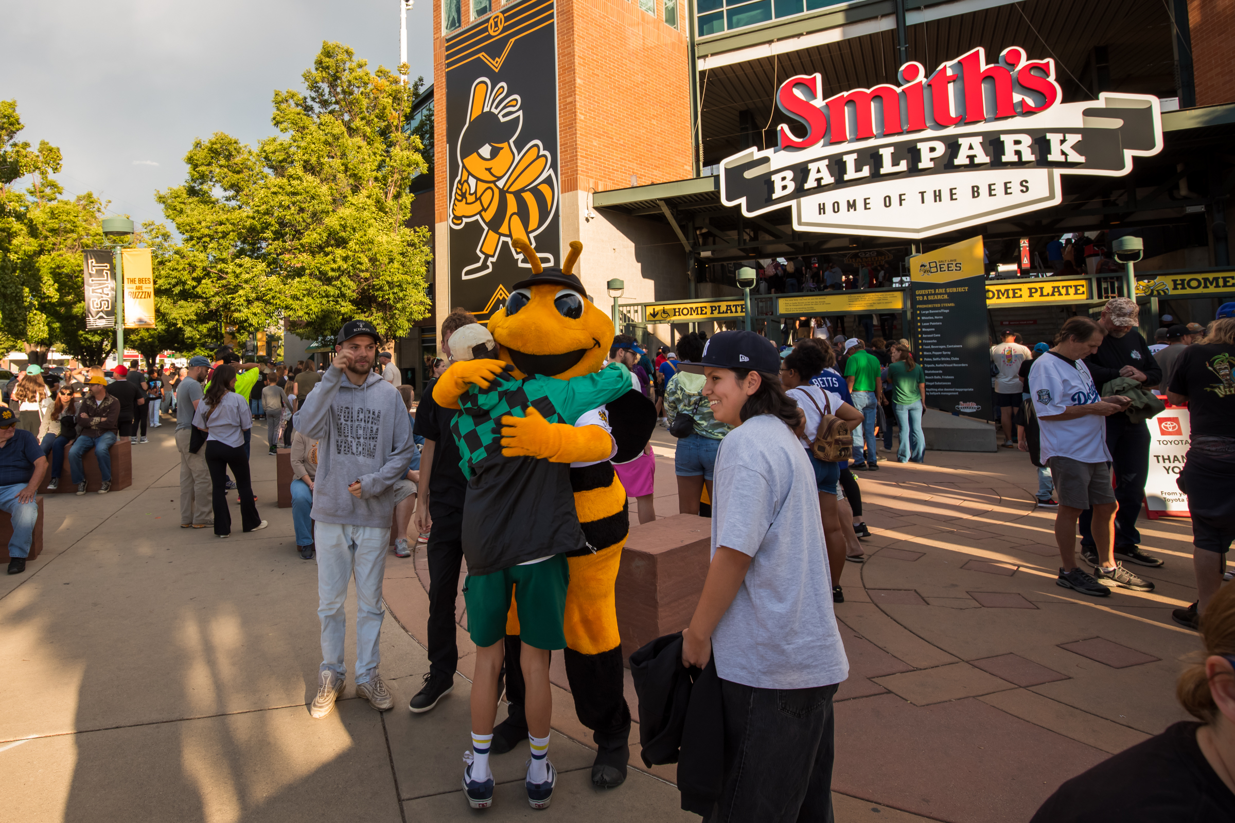 Salt Lake Bees mascot Bumble greets fans outside of Smith's Ballpark before the team's final evening game on Saturday.